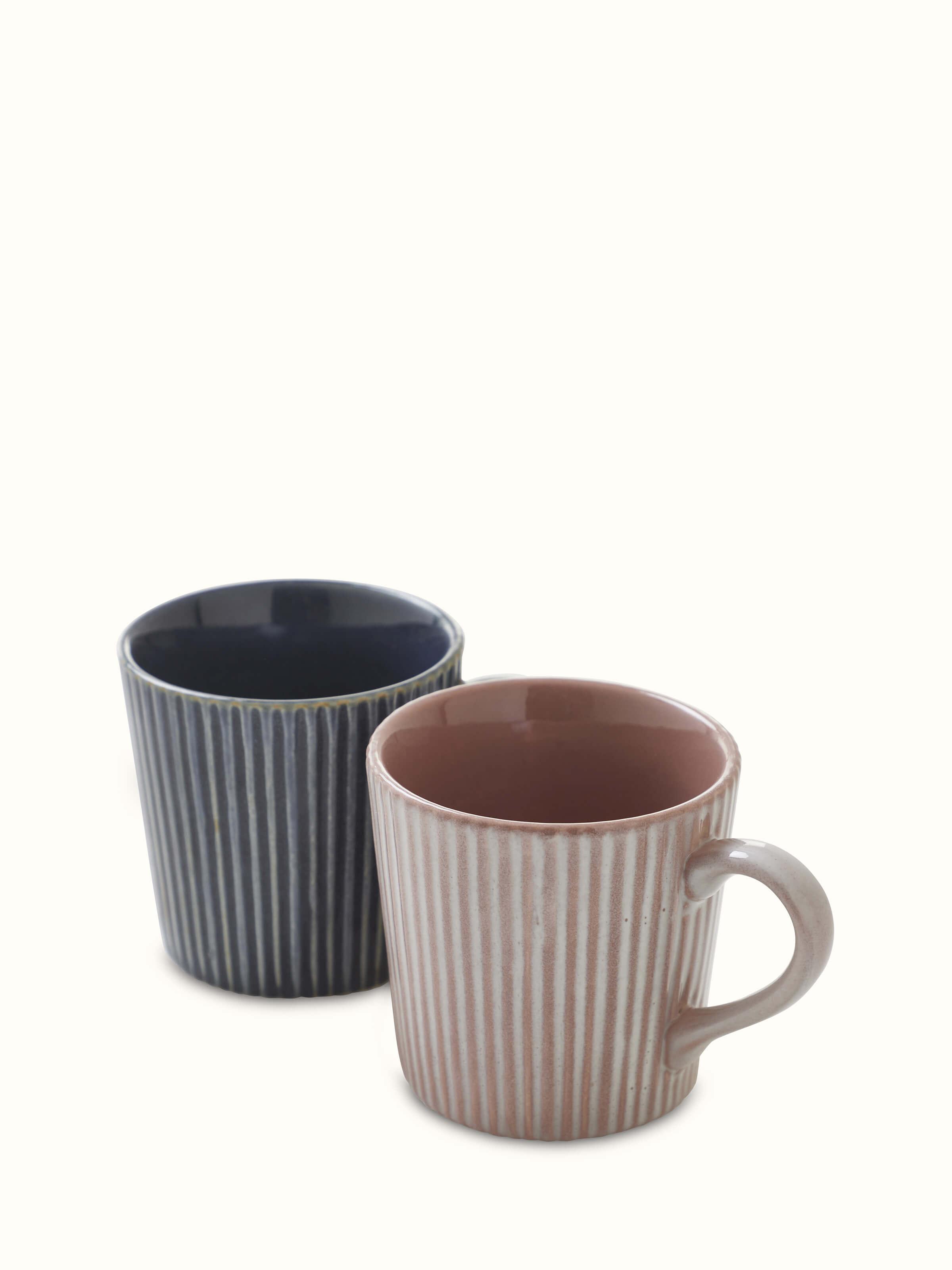 Angled view of Khurja pottery blue and white ceramic coffee mugs (2 pcs) displaying the complete design and decorative elements.