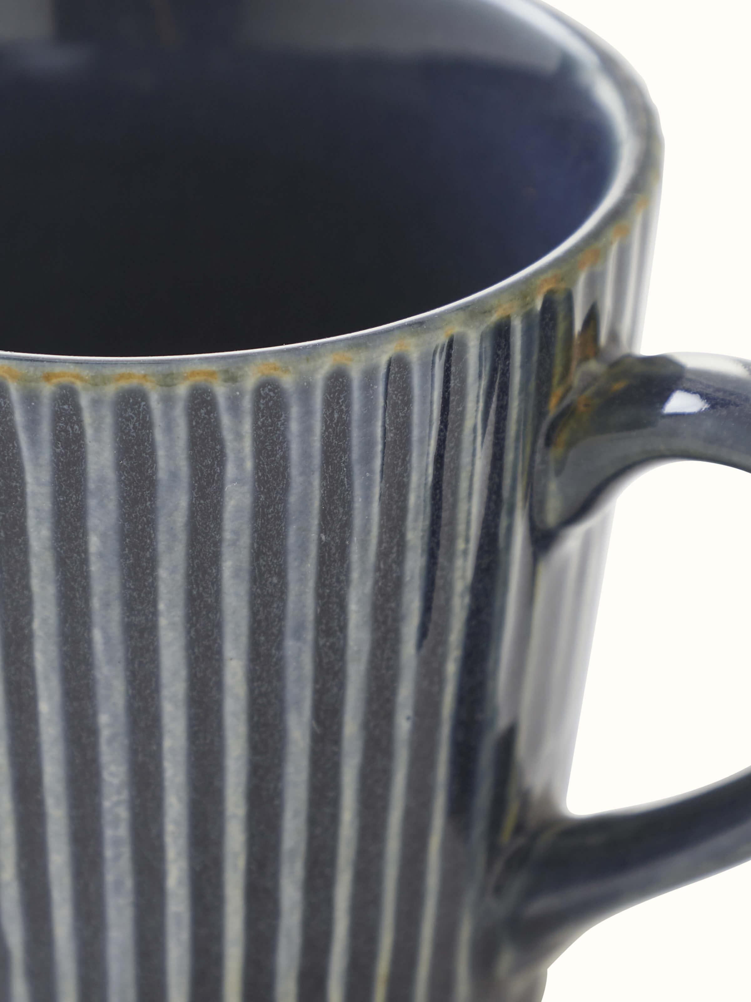 Full view of blue and white Khurja pottery ceramic coffee mugs set (2 pcs) showing the elegant design and craftsmanship from all angles.