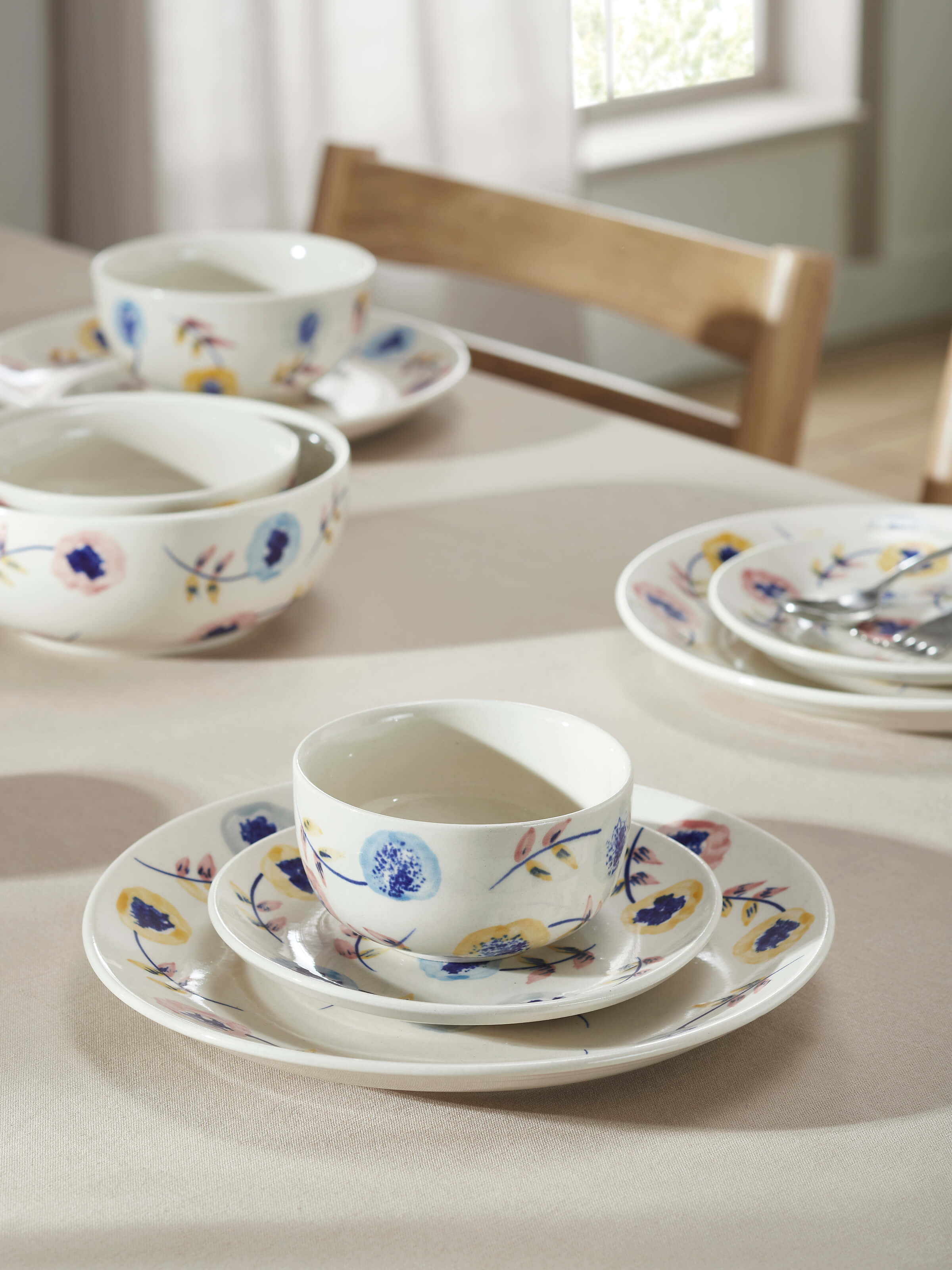 Close-up of Khurja pottery ceramic salad plates in white and blue (4 pcs) emphasizing the intricate designs and high-quality ceramic