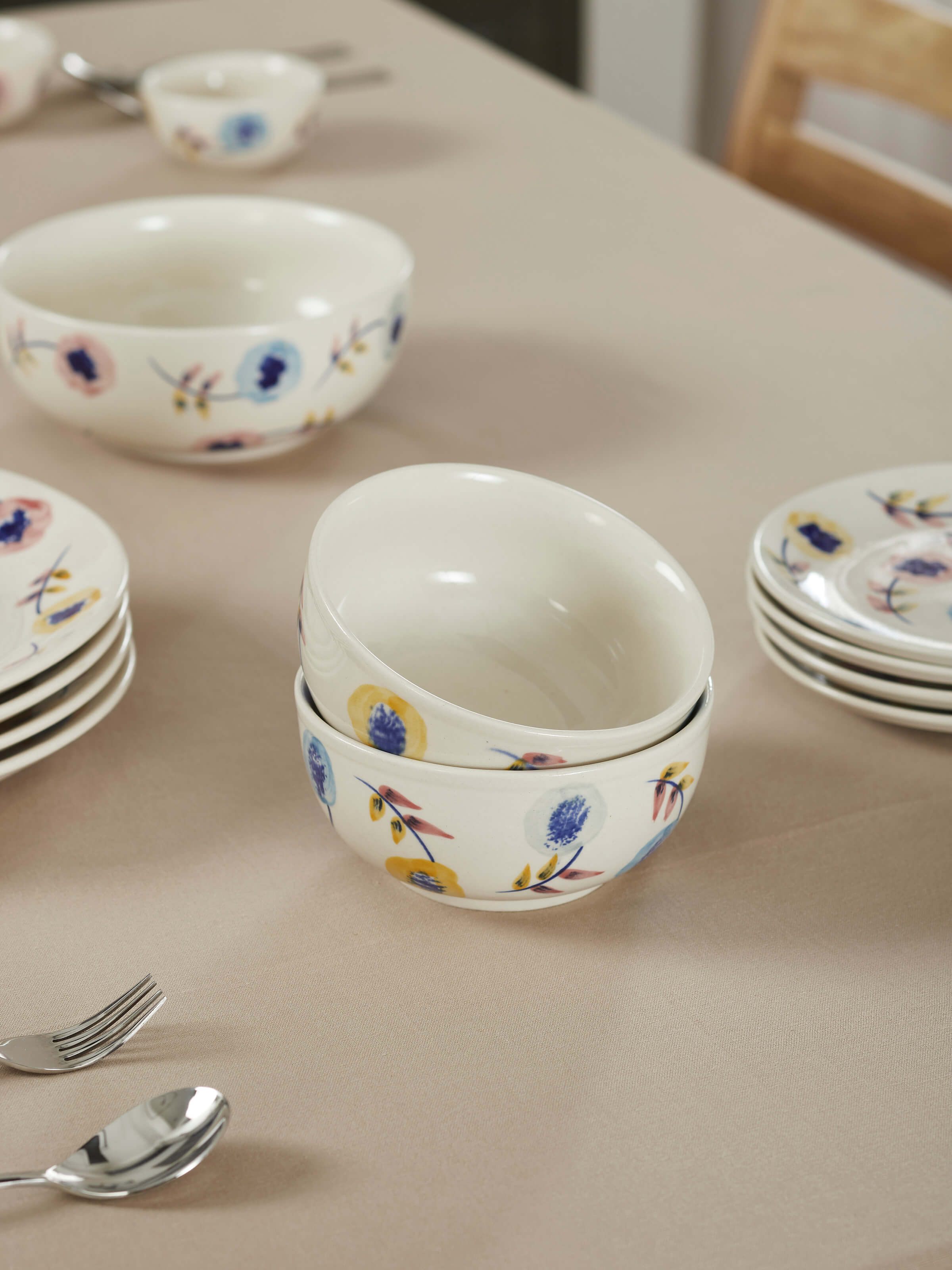 Detailed view of Khurja pottery ceramic serving bowl in white & blue focusing on the vibrant designs and ceramic finish