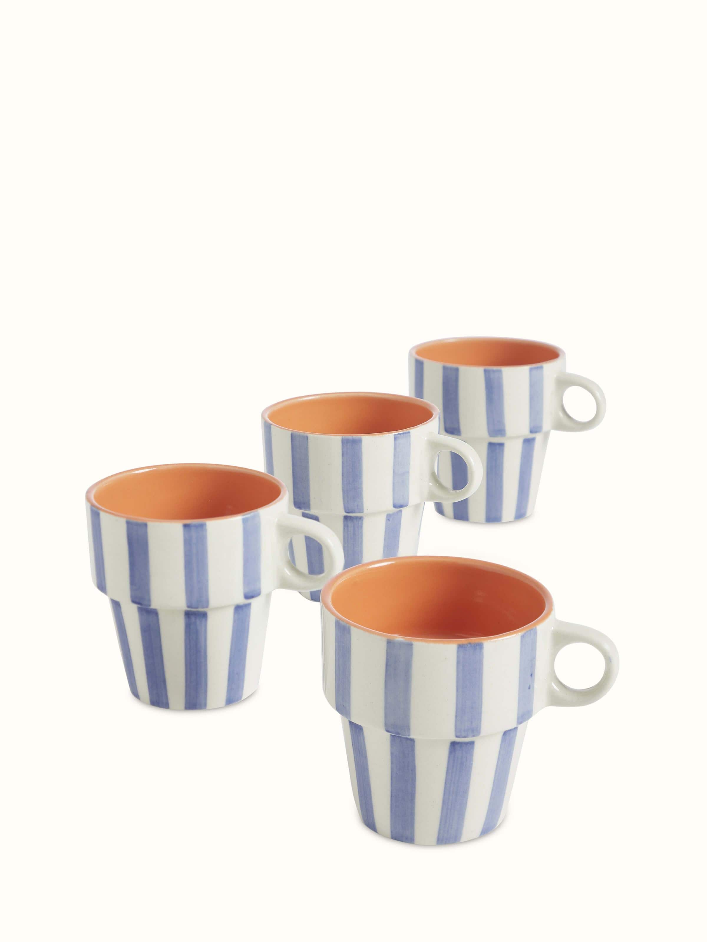 Close-up view of Khurja pottery ceramic coffee mugs in blue & white (4 pcs) focusing on the texture and paint details.