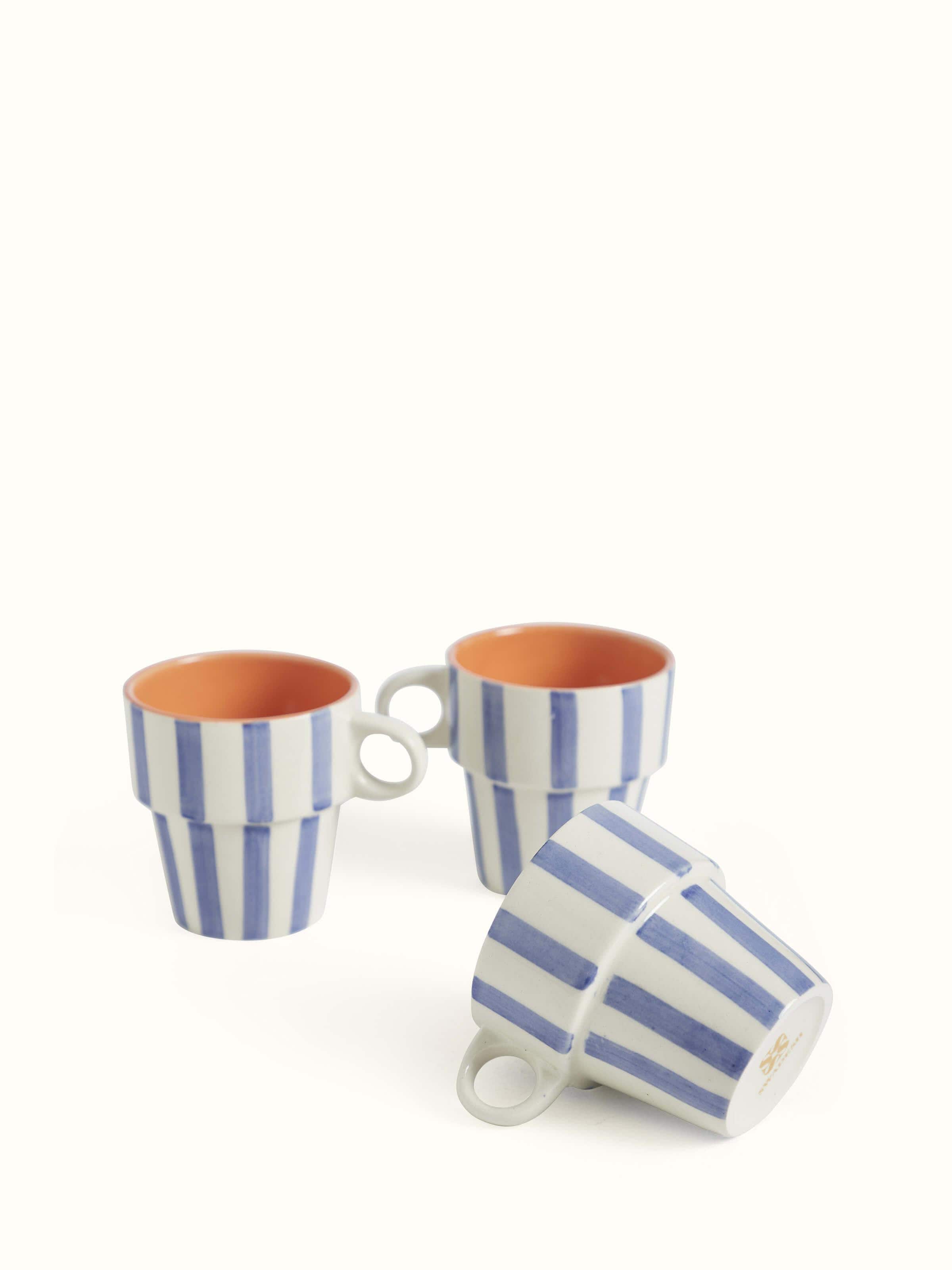 Close-up view of Khurja pottery ceramic coffee mugs in blue & white (4 pcs) emphasizing the craftsmanship and fine details.