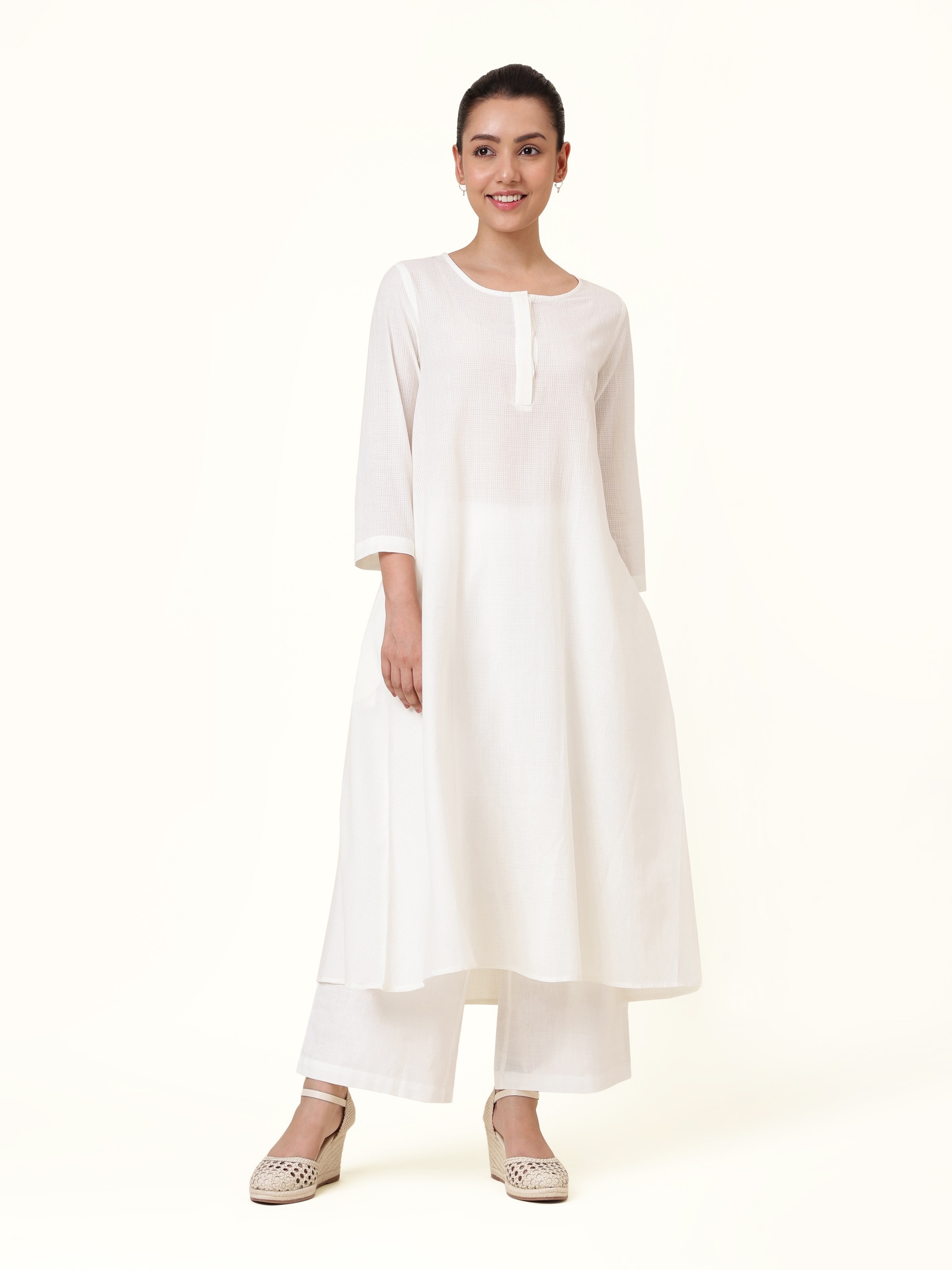 Front view of white hand-spun cotton kurta with straight cut and subtle texture.