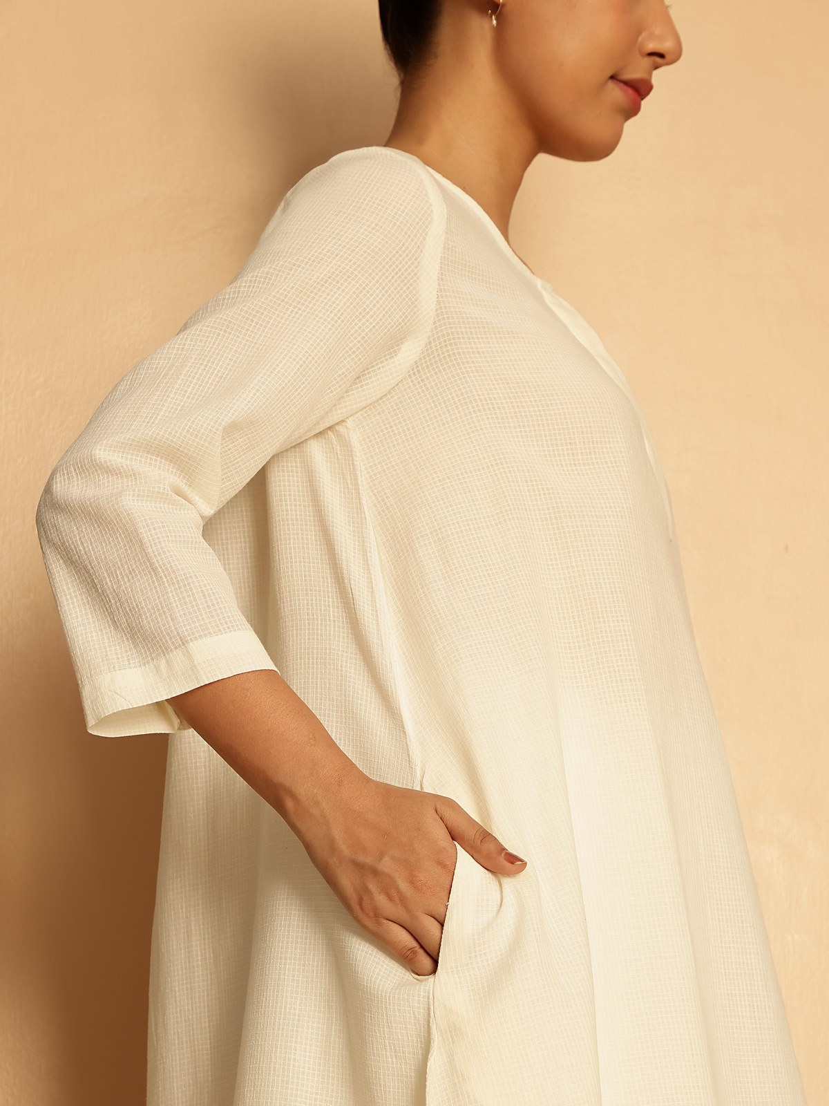 Relaxed setting featuring long cotton kurta paired with stole and flats.