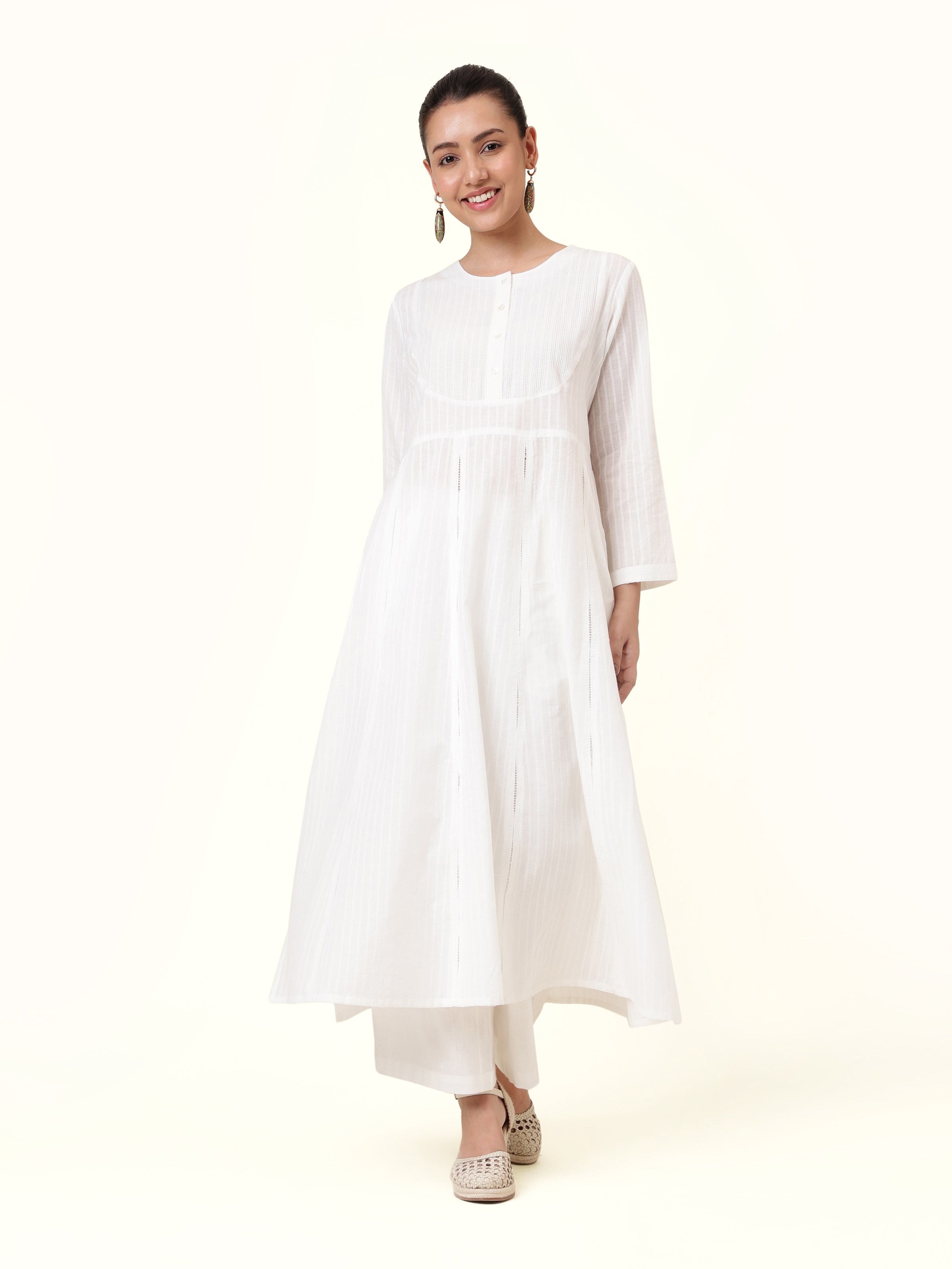 Front view of white cotton hand-spun long Anarkali kurta with subtle texture and flared silhouette.