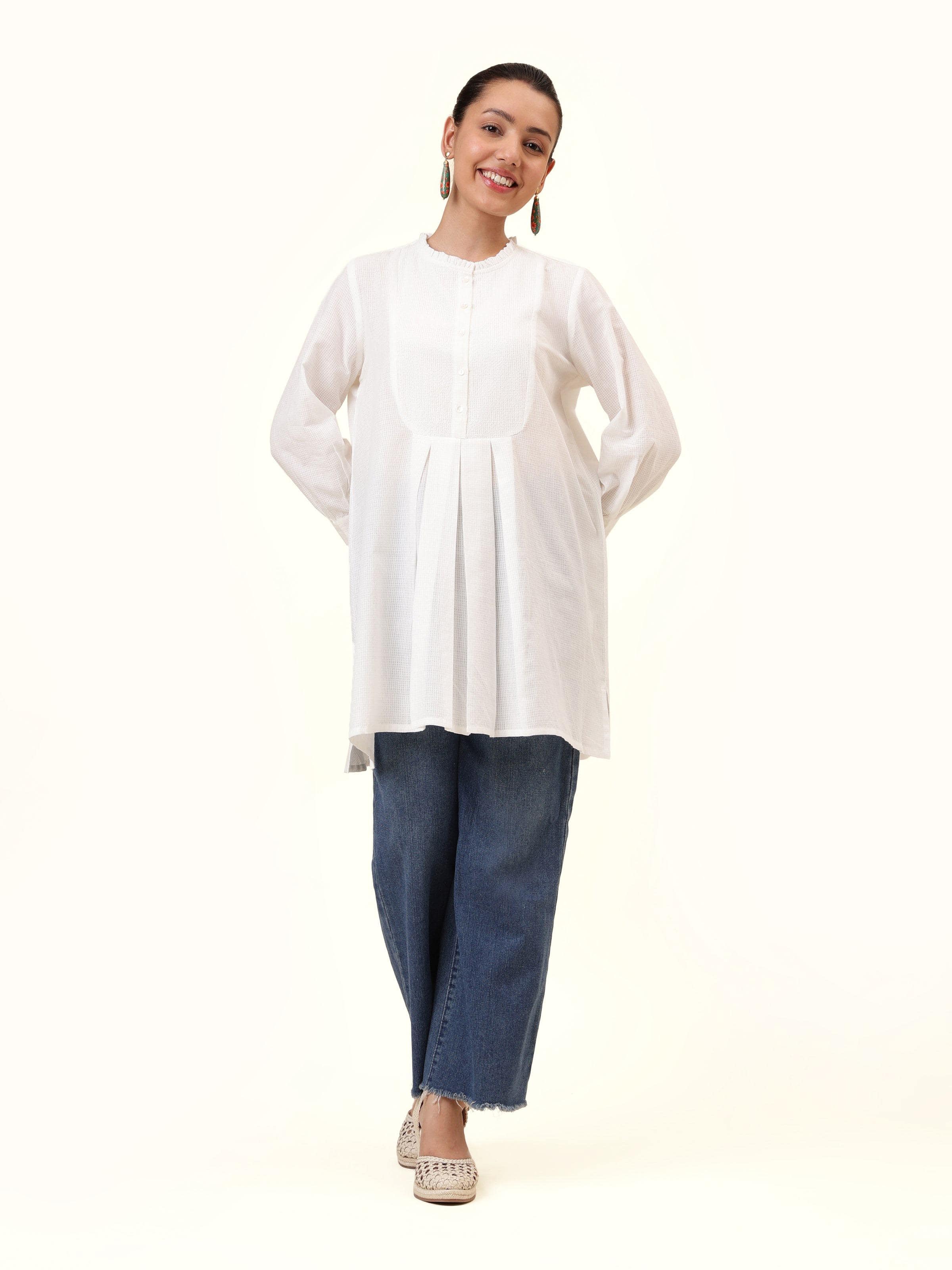 Front view of white cotton tunic featuring classic silhouette and handwoven look
