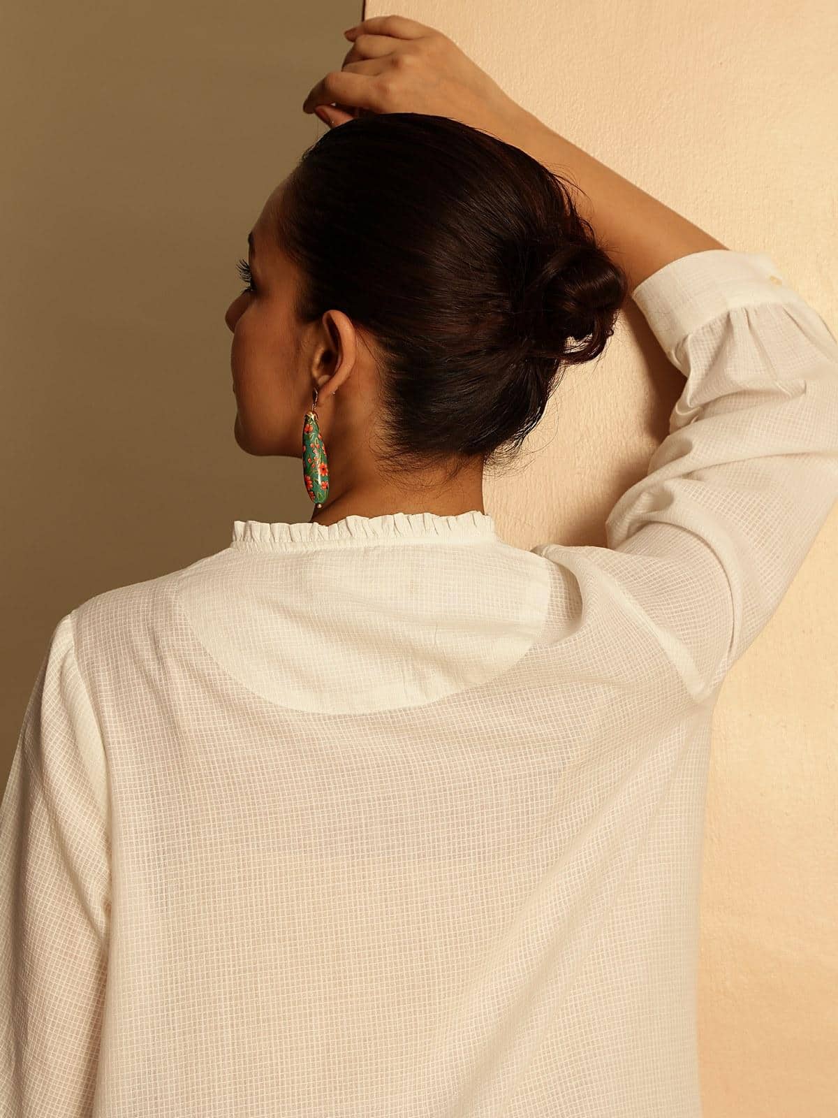 Additional lifestyle view showcasing tunic’s comfortable straight cut