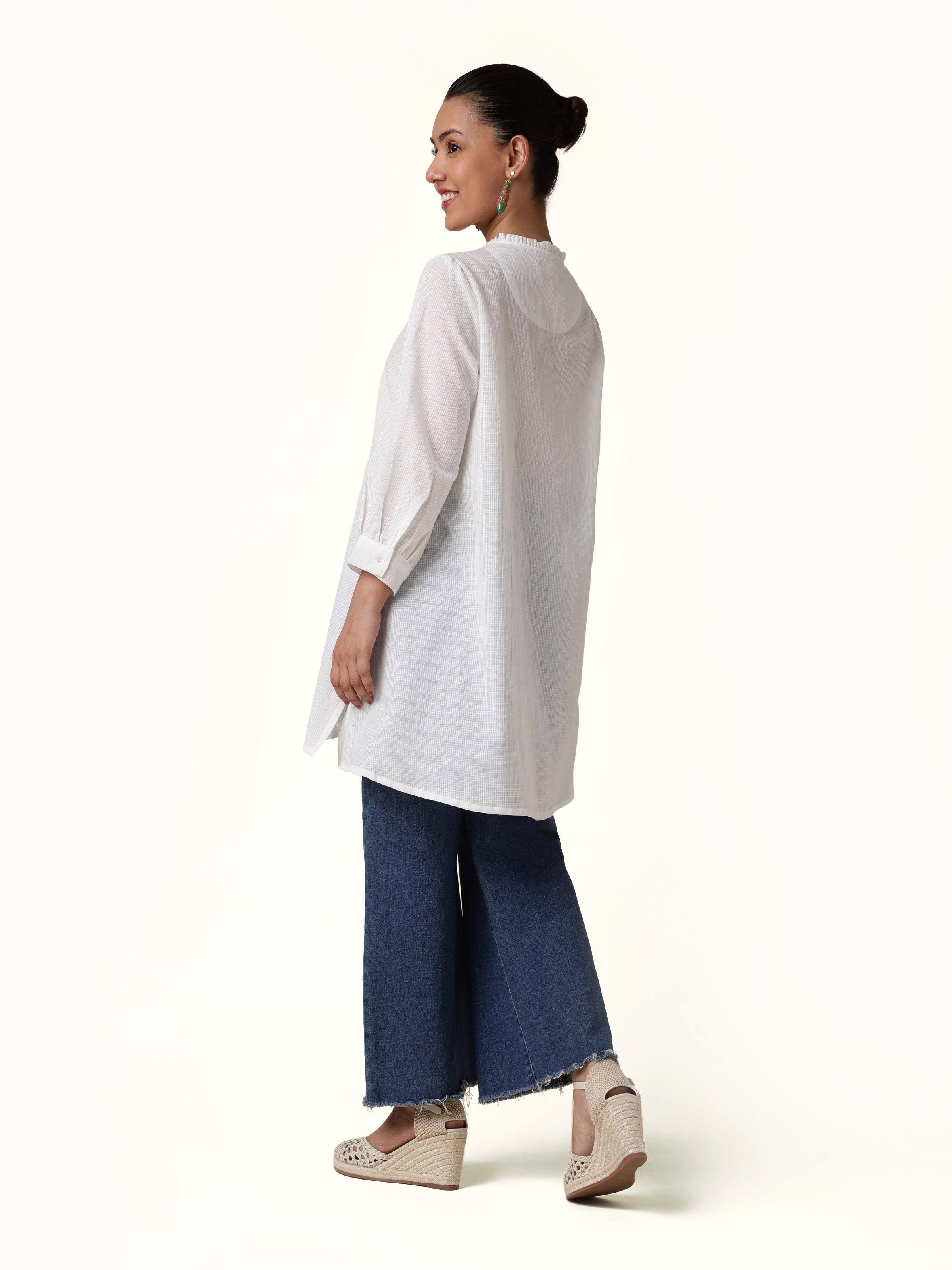 Back view of white cotton tunic showing clean finish and shoulder yoke detailing
