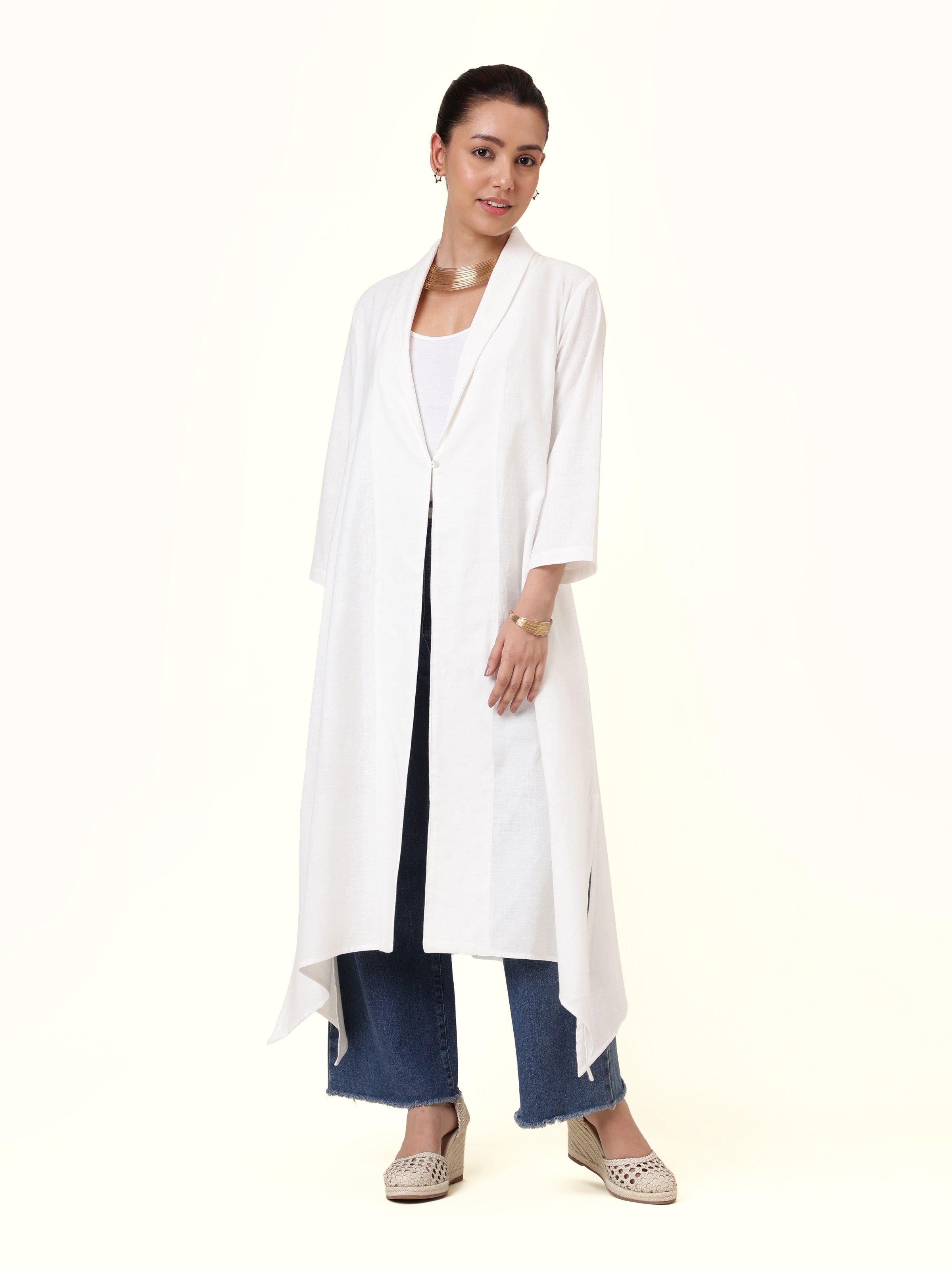 Front view of white cotton hand-spun jacket with classic collar and clean tailoring.