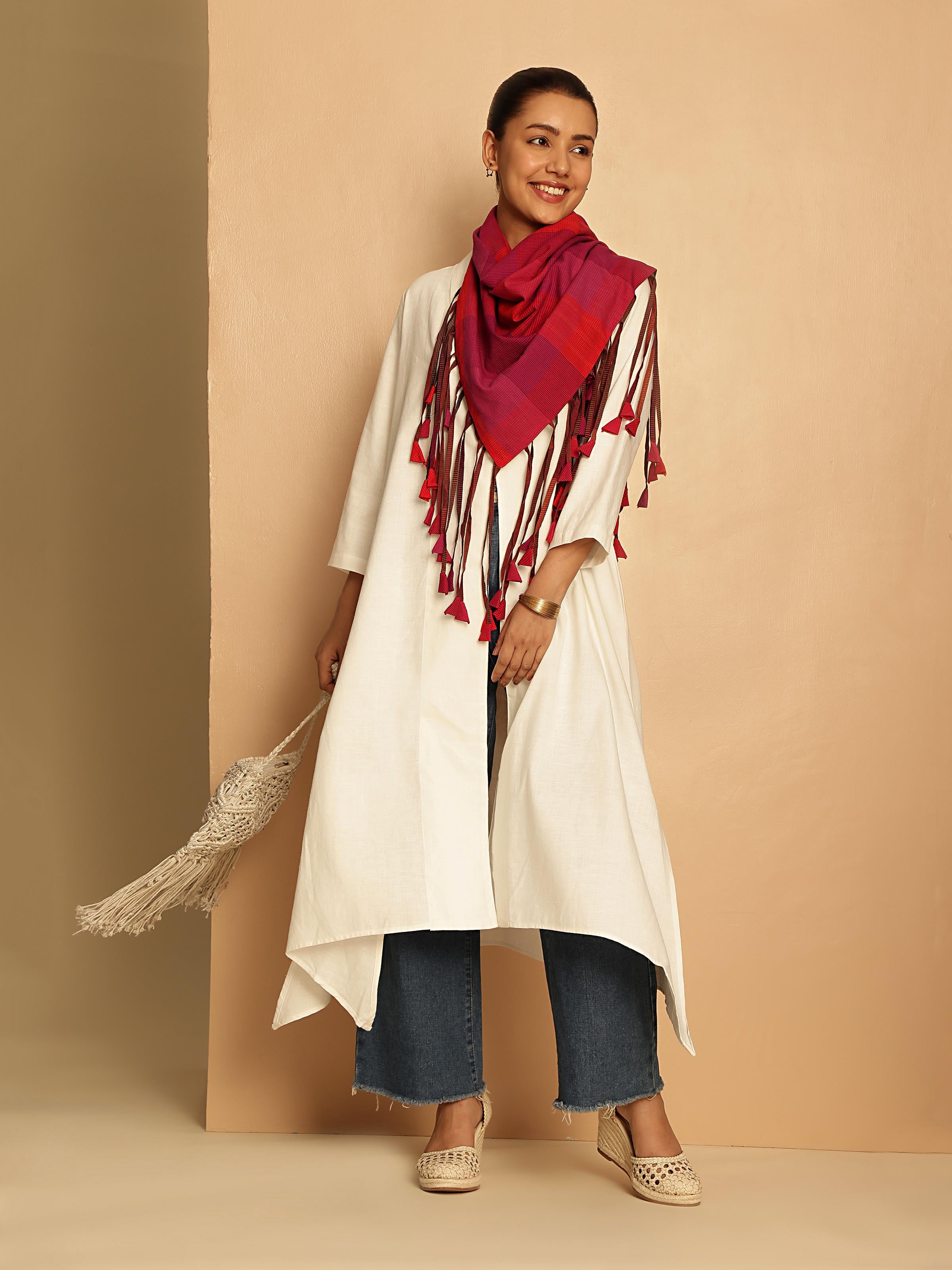 Lifestyle view of white hand-spun cotton jacket styled in a semi-formal indoor setup.