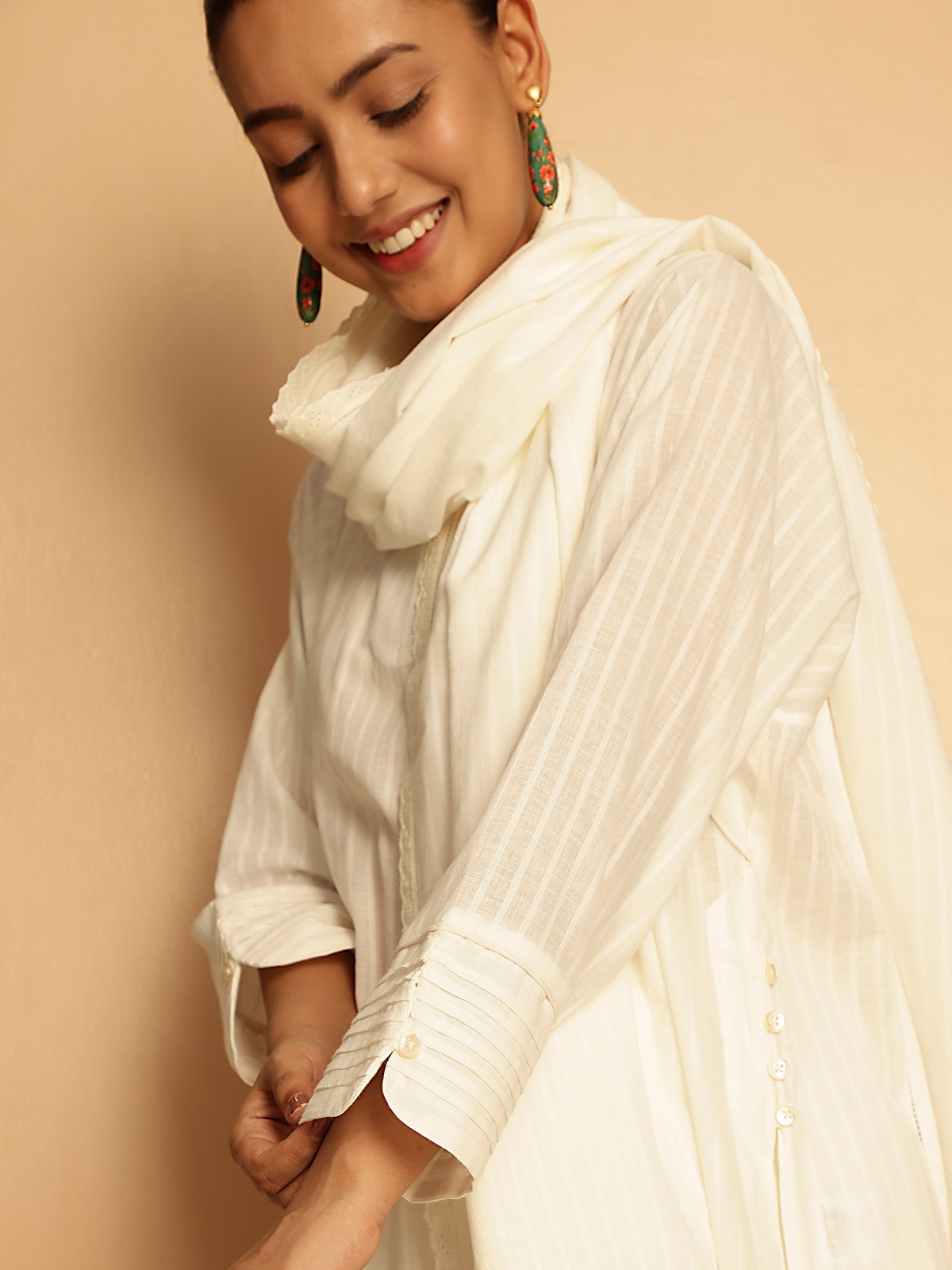 Angled view of White Cotton Hand-spun Long Kurta with Pleated Cuff displaying full silhouette and cuff design