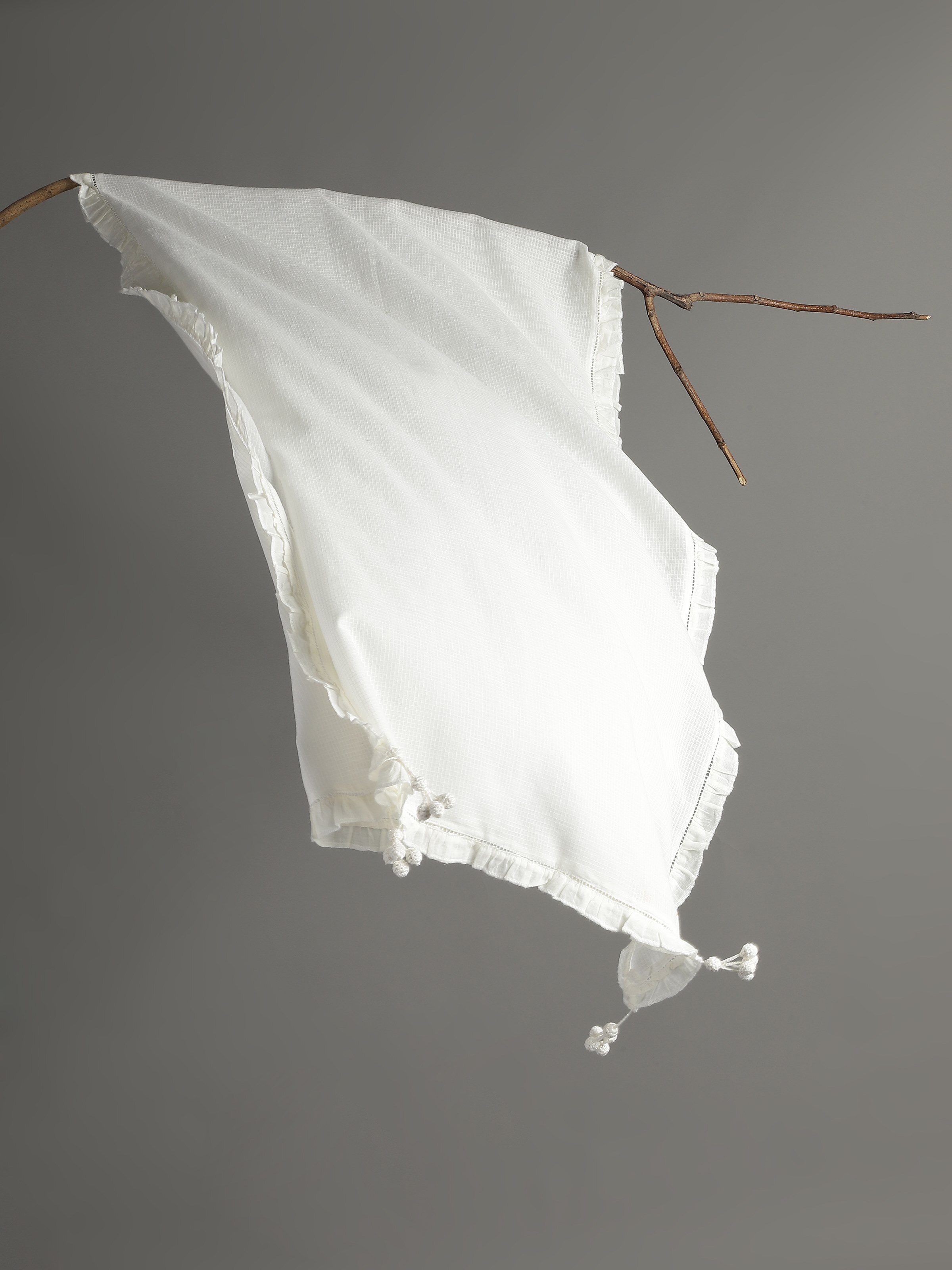 Close-up highlighting the fine hand-spun weave and gentle texture.