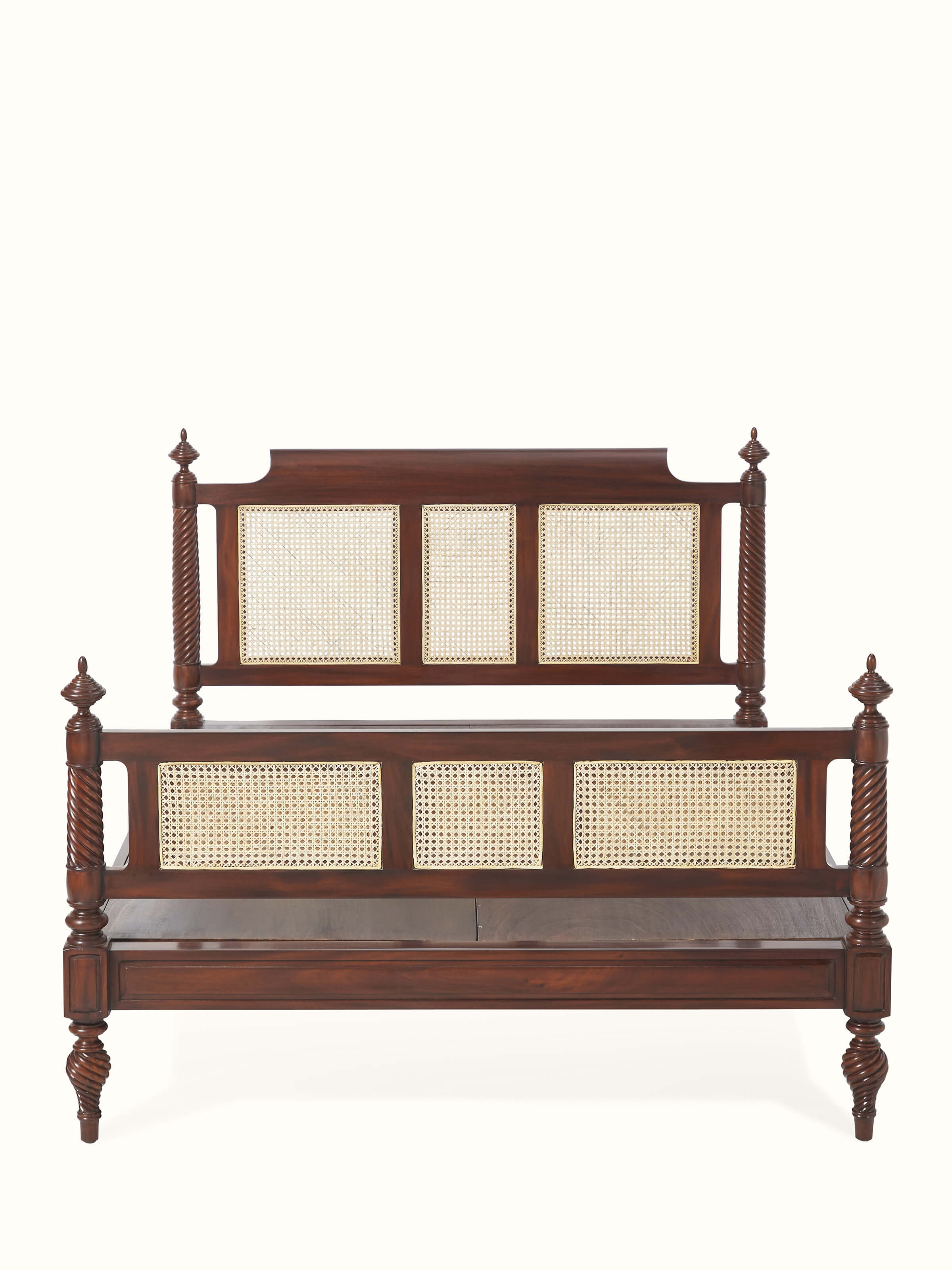 Front view of the carved mahogany wood and cane queen size bed, showcasing its intricate design and elegant finish.