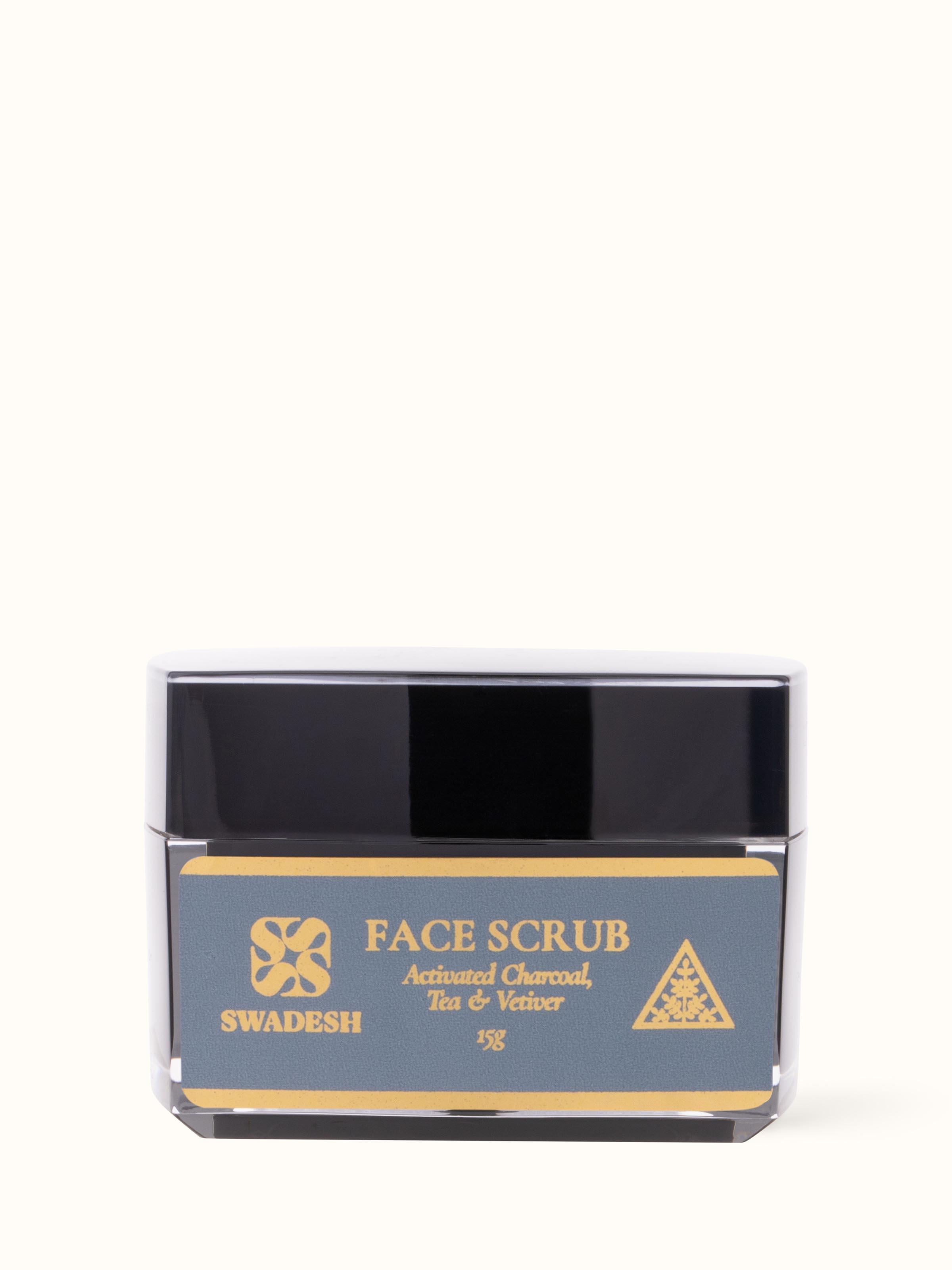 Front view of Face Scrub Activated Charcoal, Tea & Vetiver highlighting the container's design and product label.