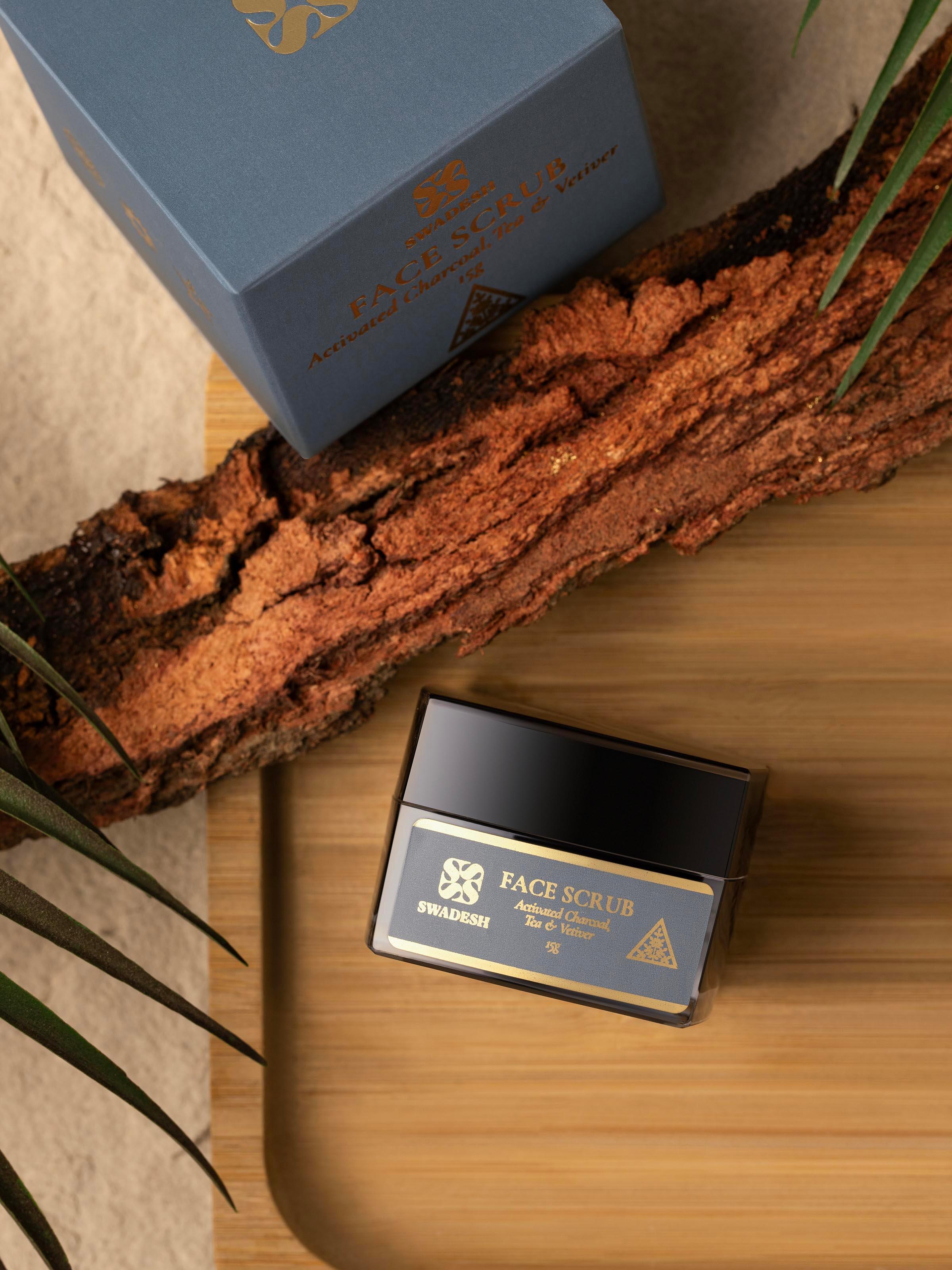 Side view of Face Scrub Activated Charcoal, Tea & Vetiver showing the detailed label and texture of the scrub.