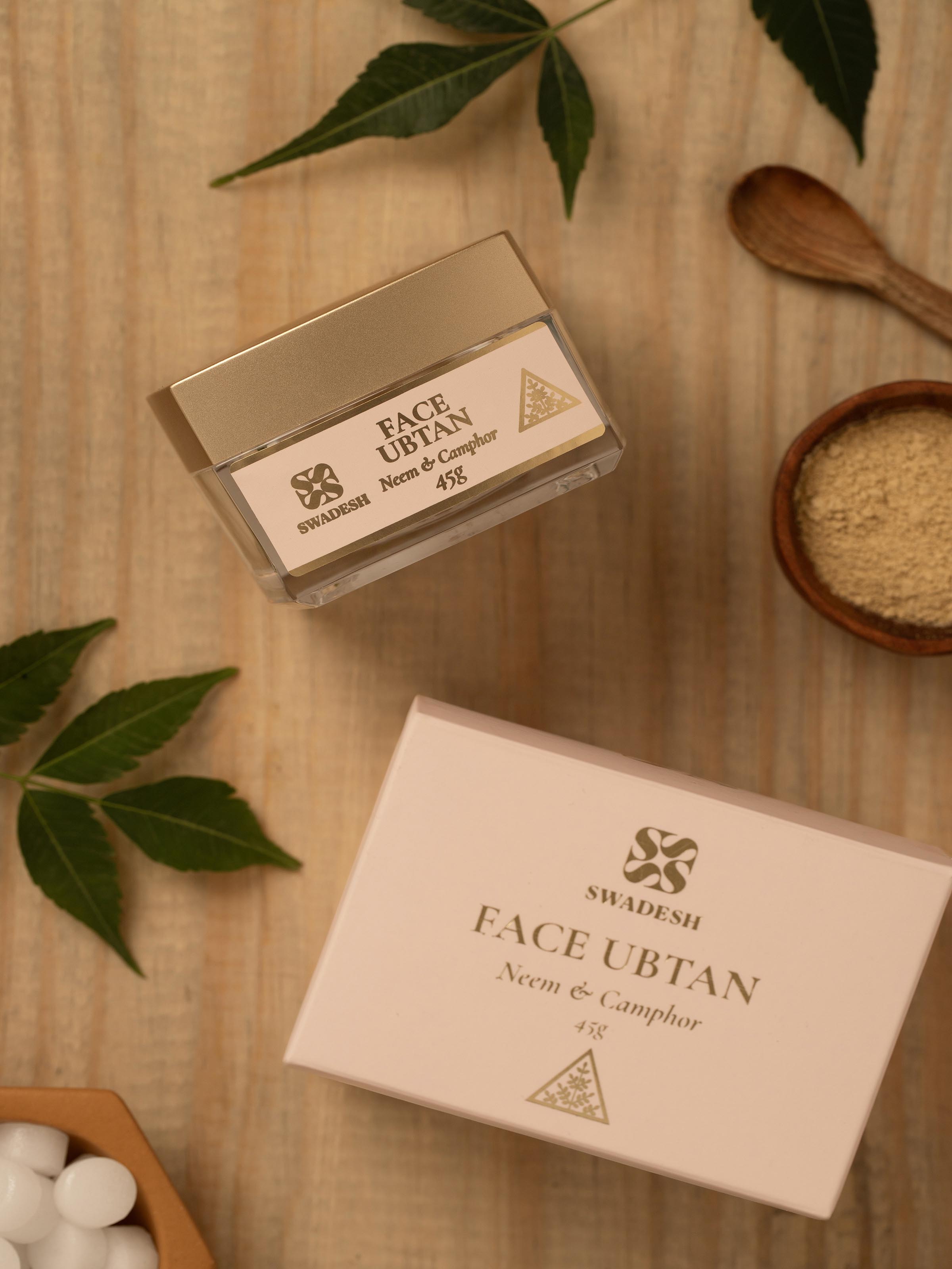 Side view of Face Ubtan Neem & Camphor displaying the product label and key benefits