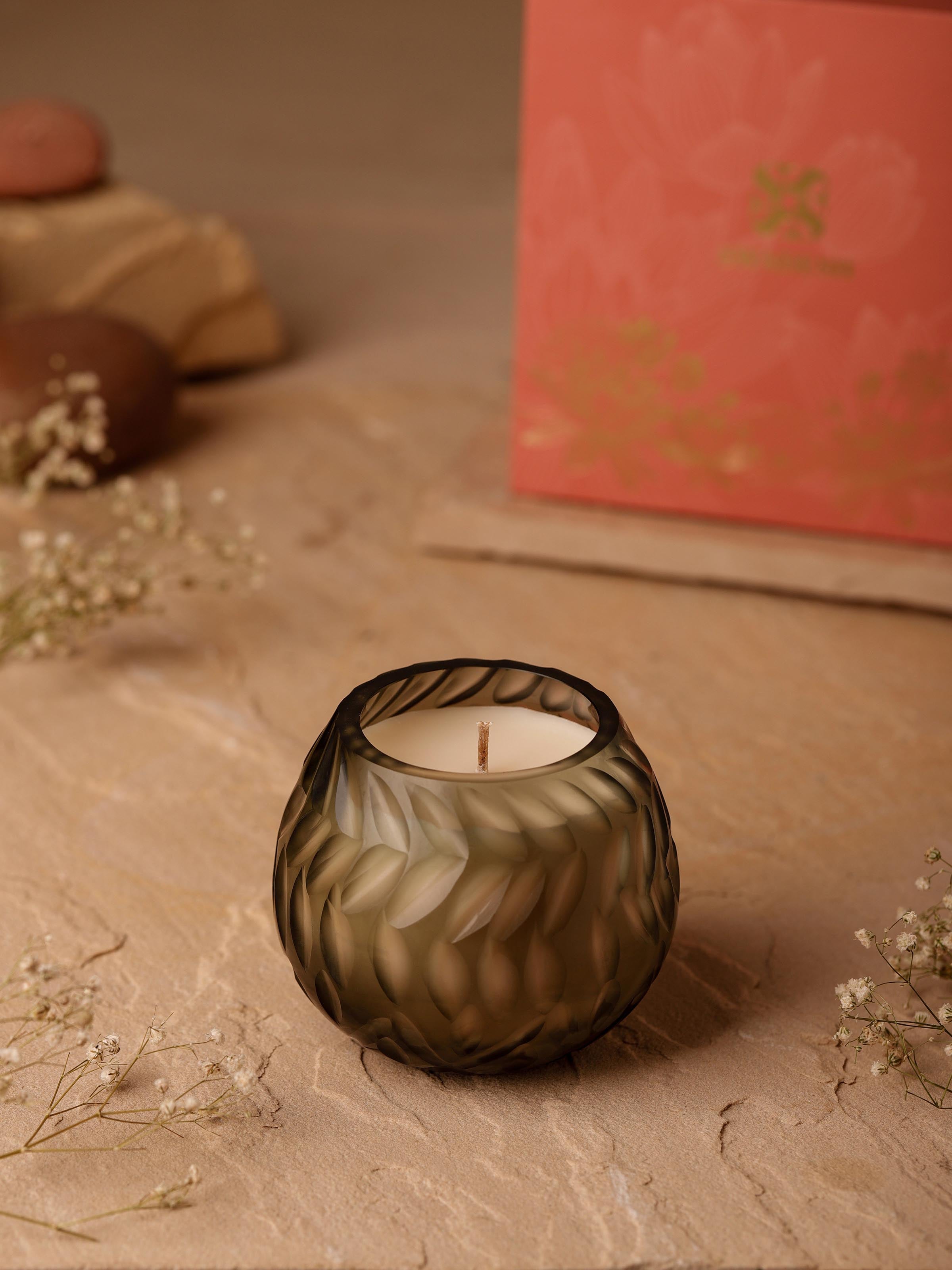 Close-up view of Jasmine Glass Candle highlighting the decorative glass texture and candle wick