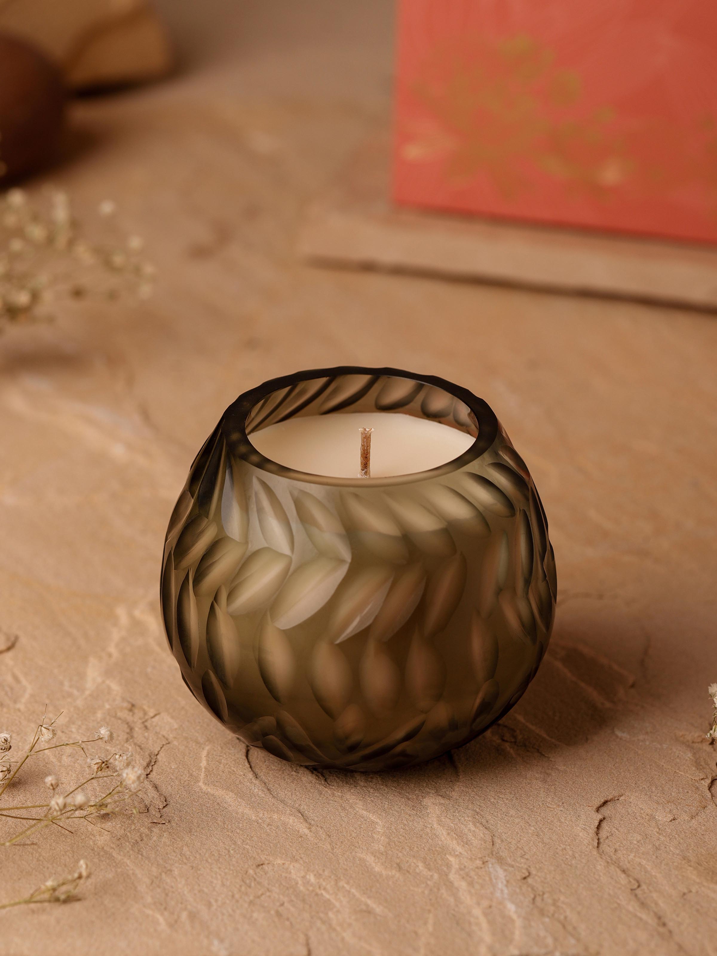 Side view of Jasmine Glass Candle emphasizing the candle’s height and glass container
