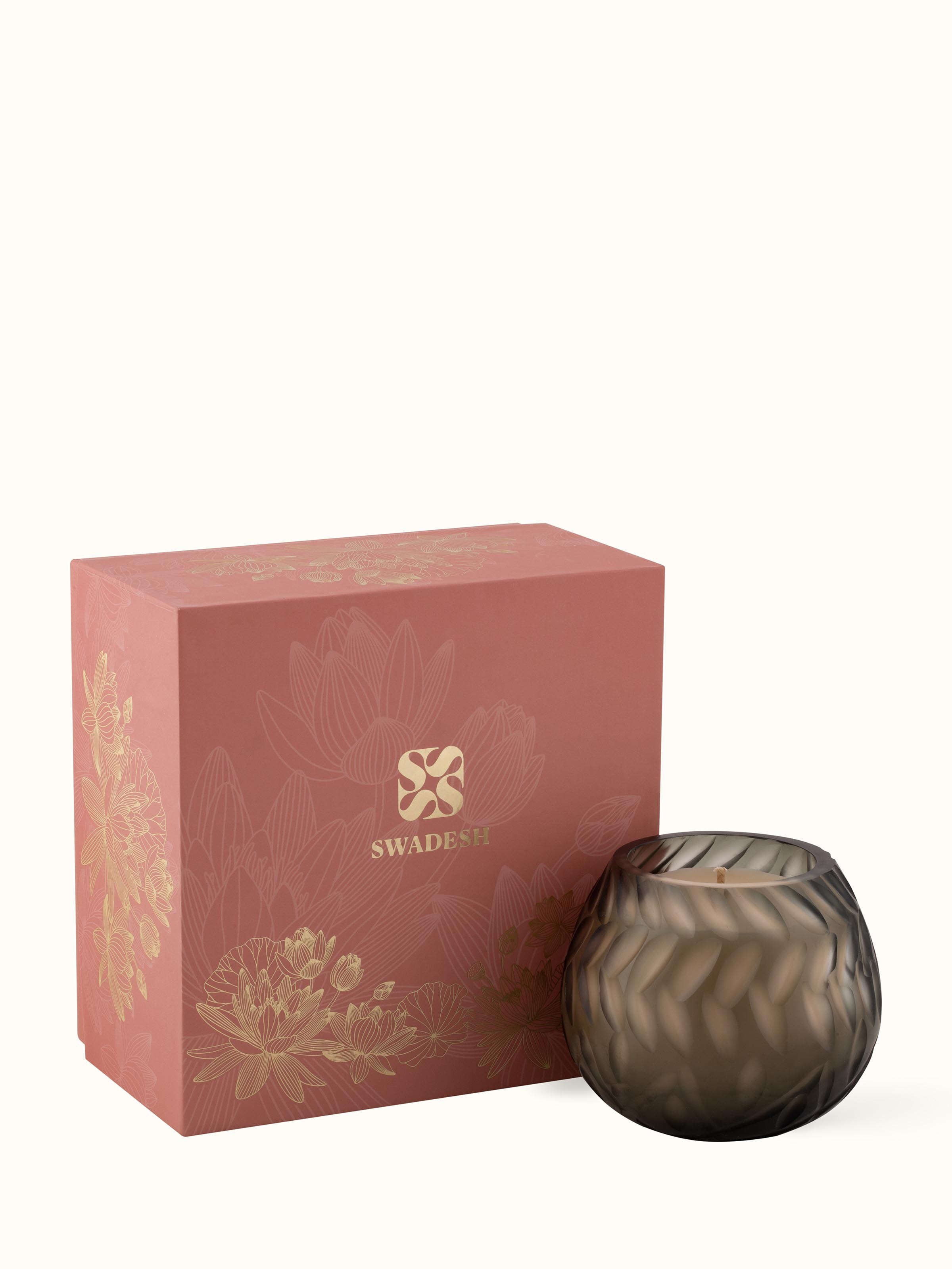 Detailed view of Jasmine Glass Candle focusing on the candle’s label and decorative elements