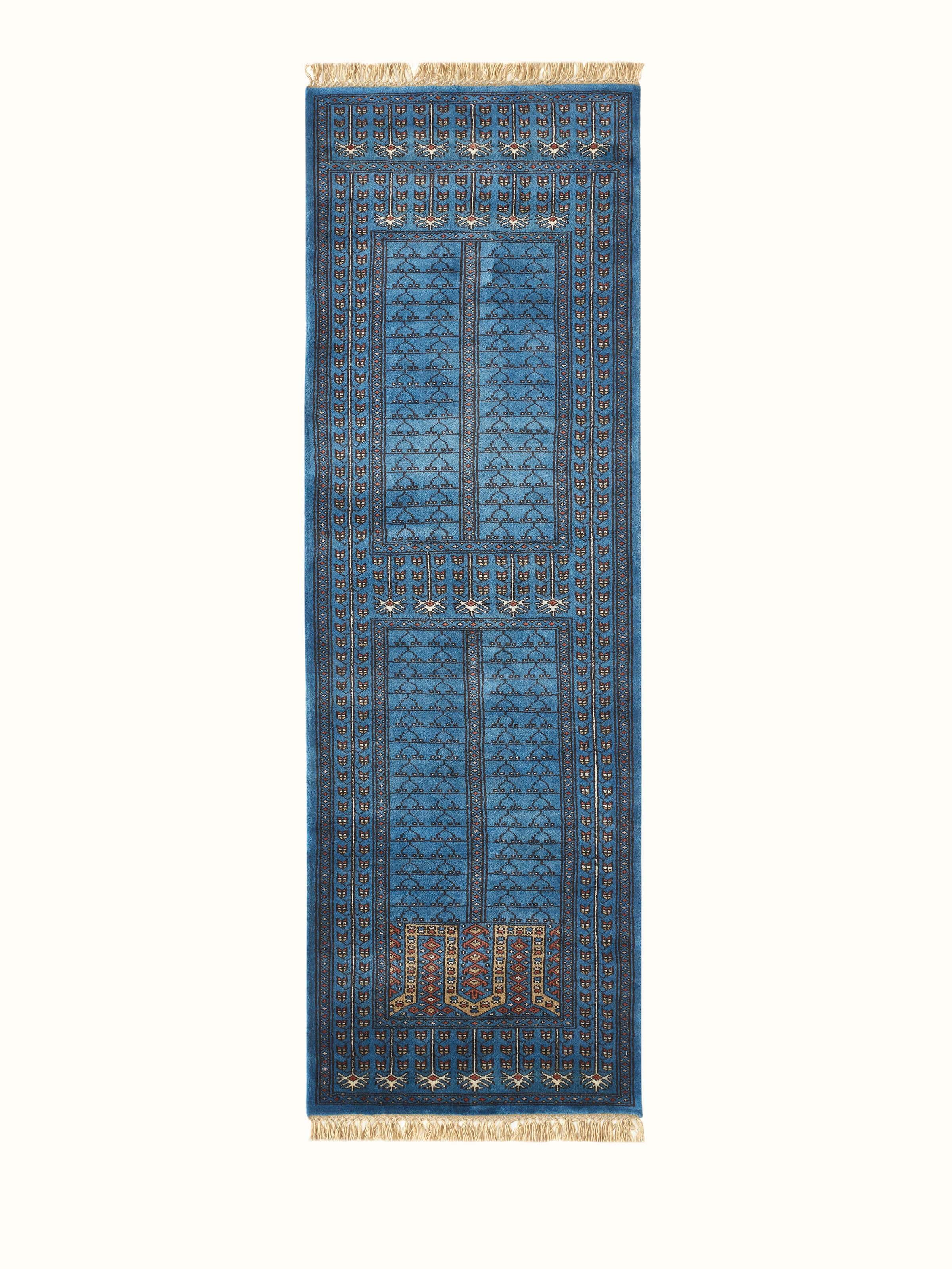 Full view of the Amritsari parda blue Gwalior wool hand-knotted runner, displaying the intricate pattern and color.