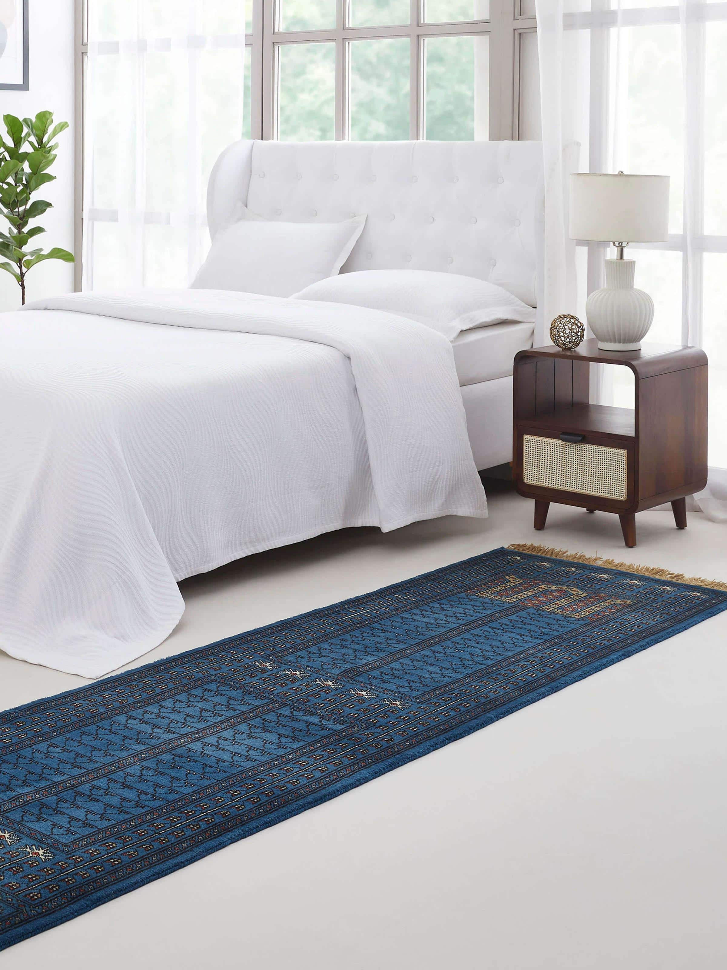Wide layout of Amritsari Parda Runner in Blue, displaying intricate Gwalior wool hand-knotting with traditional motifs.