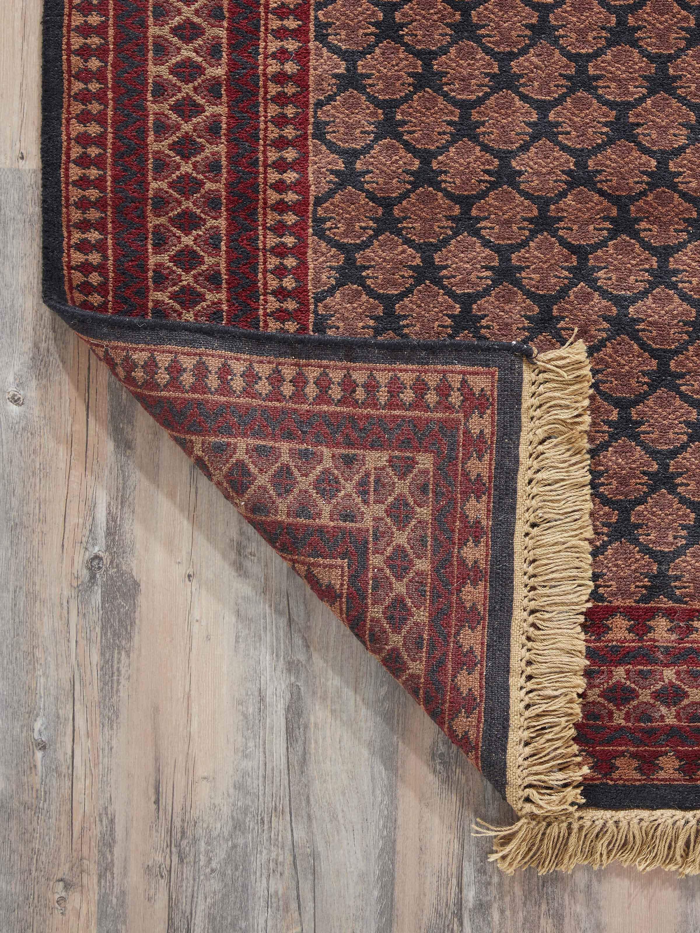 Detailed view of Traditional Lichi Red Charcoal Gwalior Wool Hand-Knotted Rug (4x6 ft) focusing on intricate weaving.
