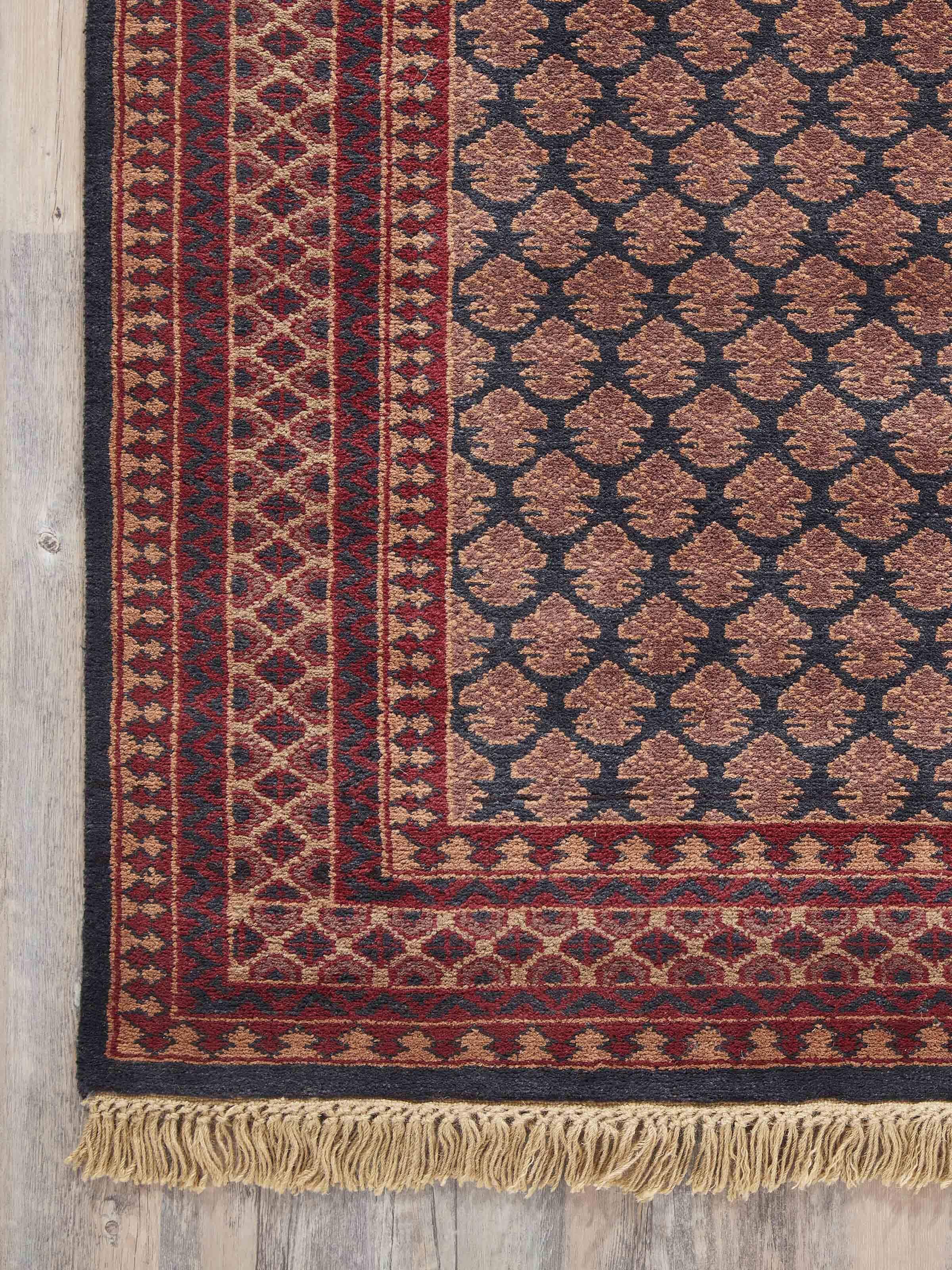 Close-up of Traditional Lichi Red Charcoal Gwalior Wool Hand-Knotted Rug (4x6 ft) showcasing fine details and textures.