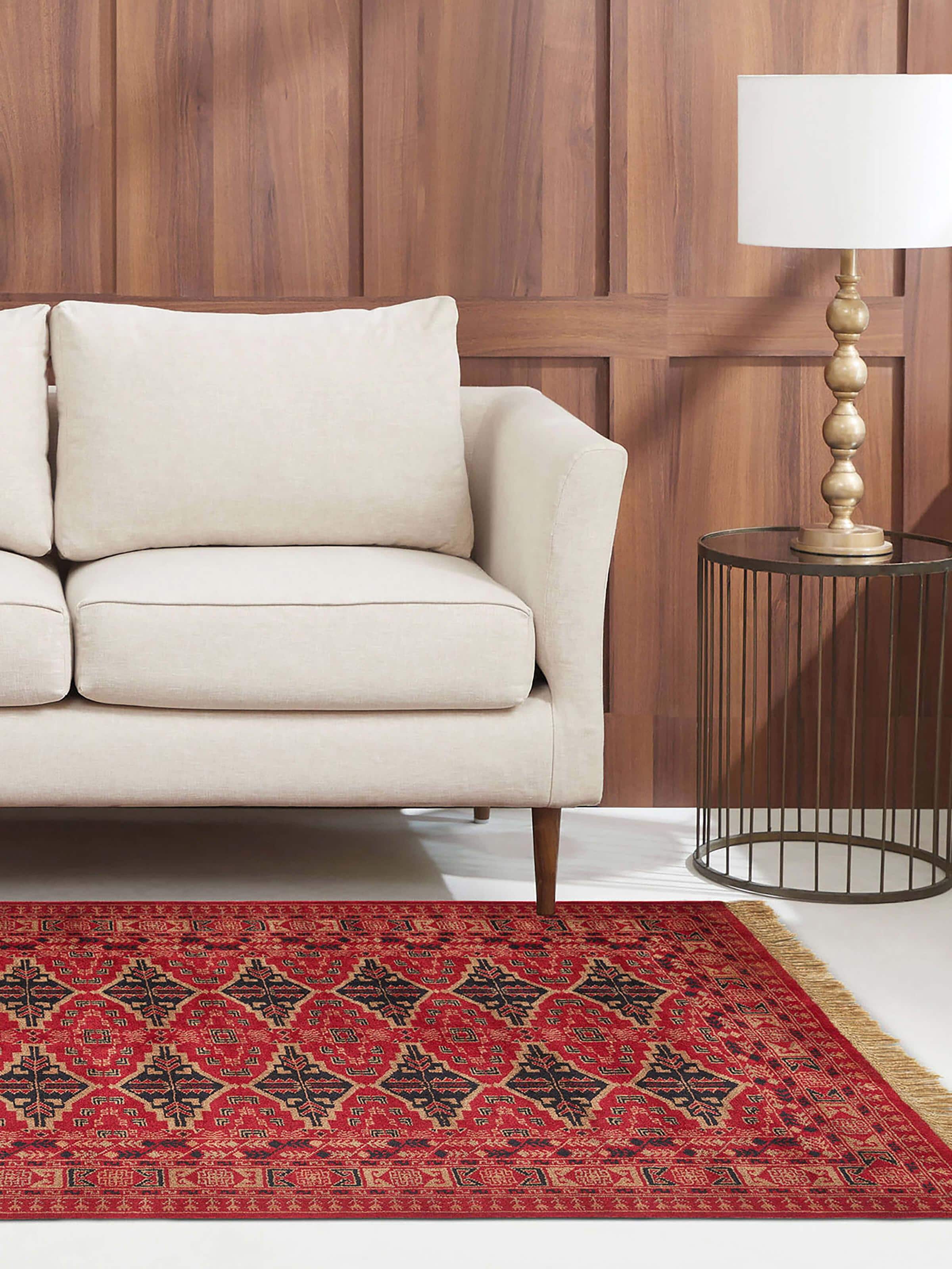 Lifestyle view of 4x6 ft Bukhara-style red wool rug from Gwalior with geometric hand-knotted patterns