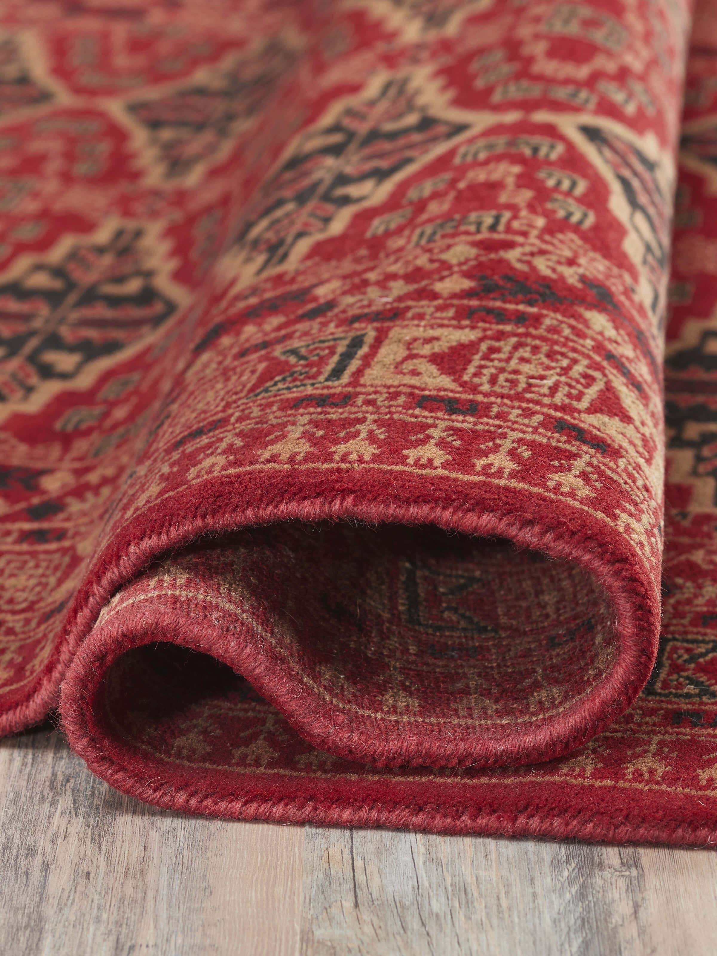 Detailed view of Traditional Persian Shiraz red Gwalior wool hand-knotted rug (4x6 ft) focusing on the intricate knotting and red patterns.