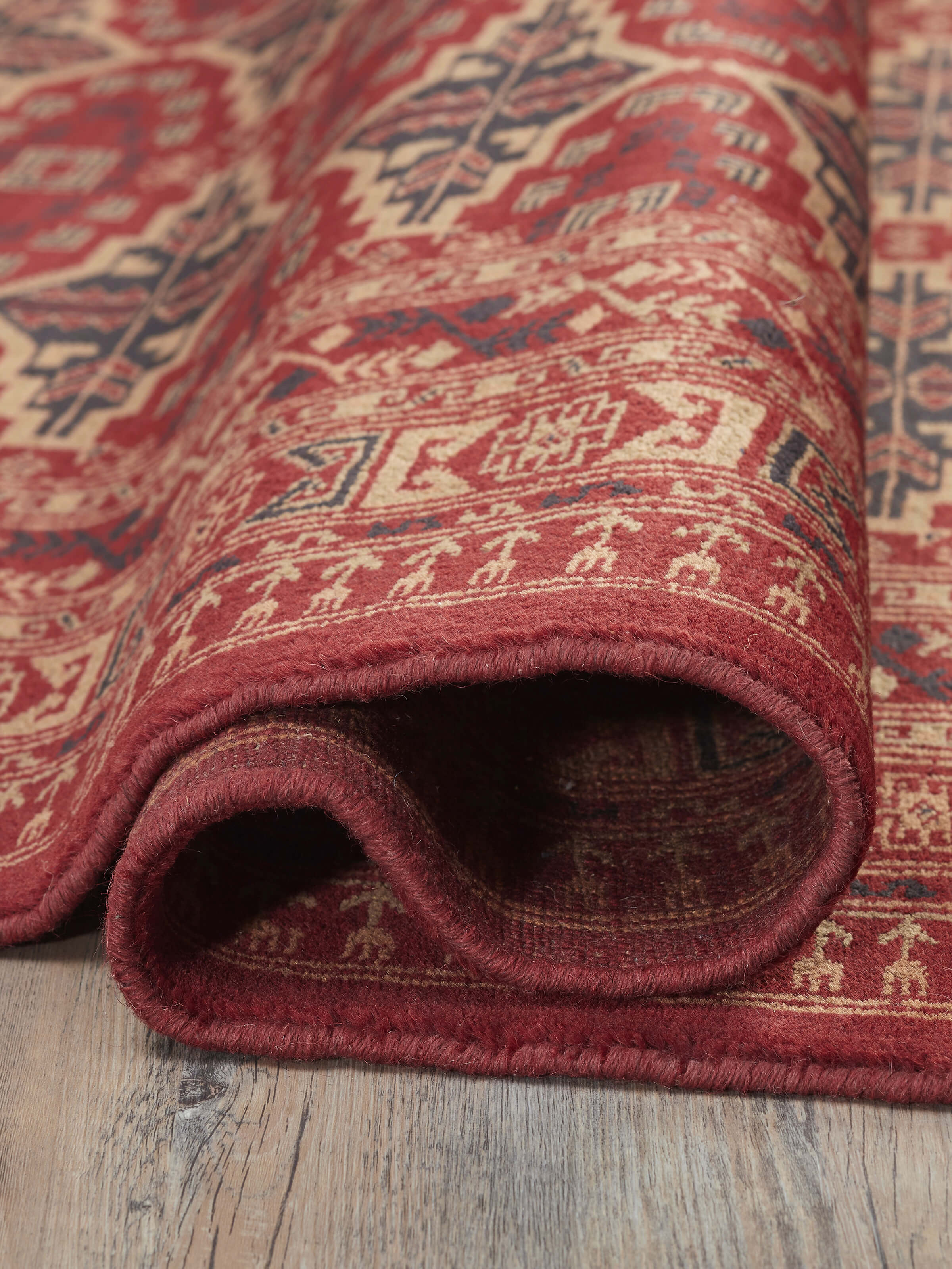 Close-up view of Traditional Persian Shiraz red Gwalior wool hand-knotted rug (6x9 ft) emphasizing detailed weaving