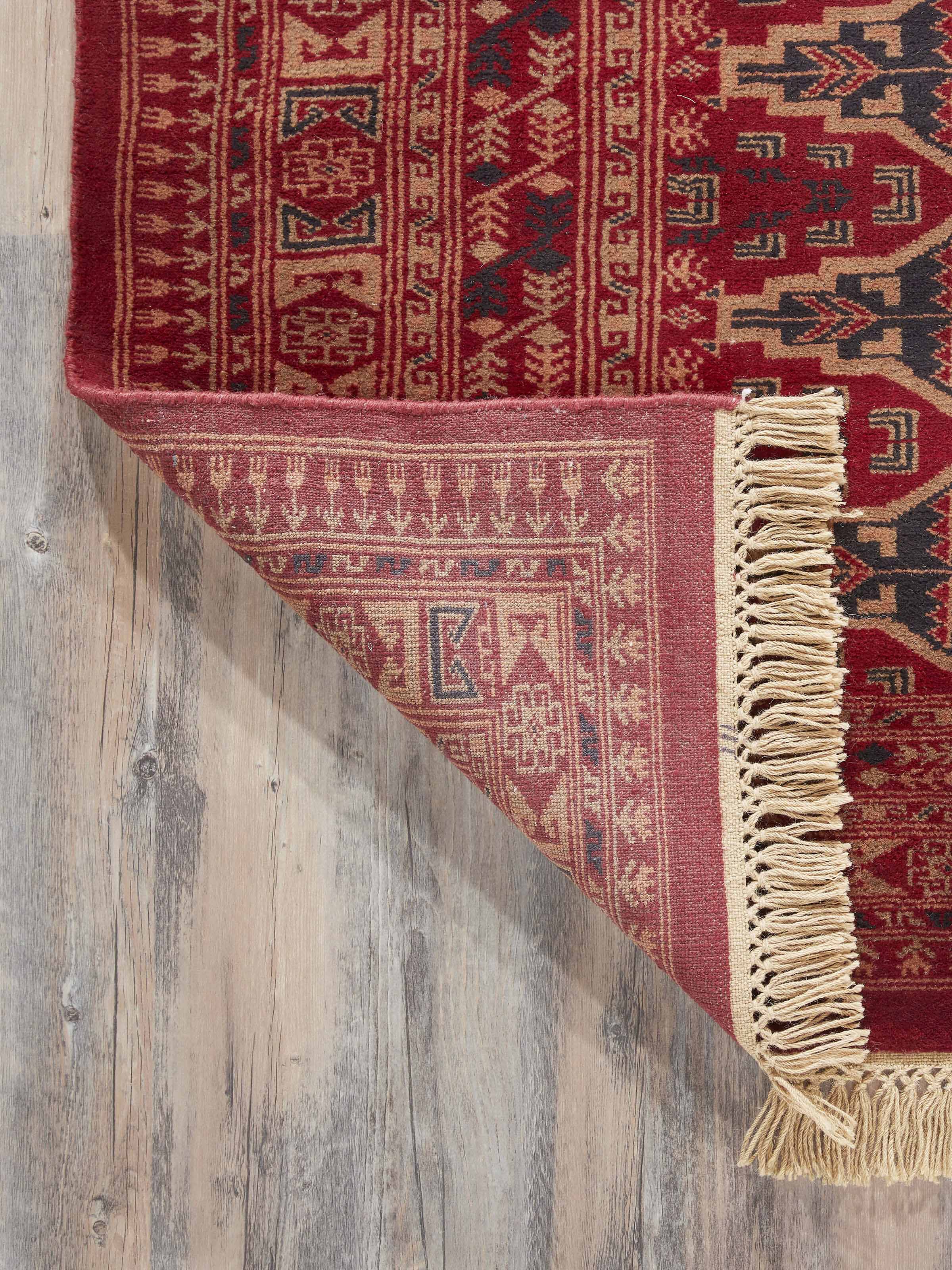 Back view of Traditional Persian Shiraz red Gwalior wool hand-knotted rug (6x9 ft) showing construction and quality