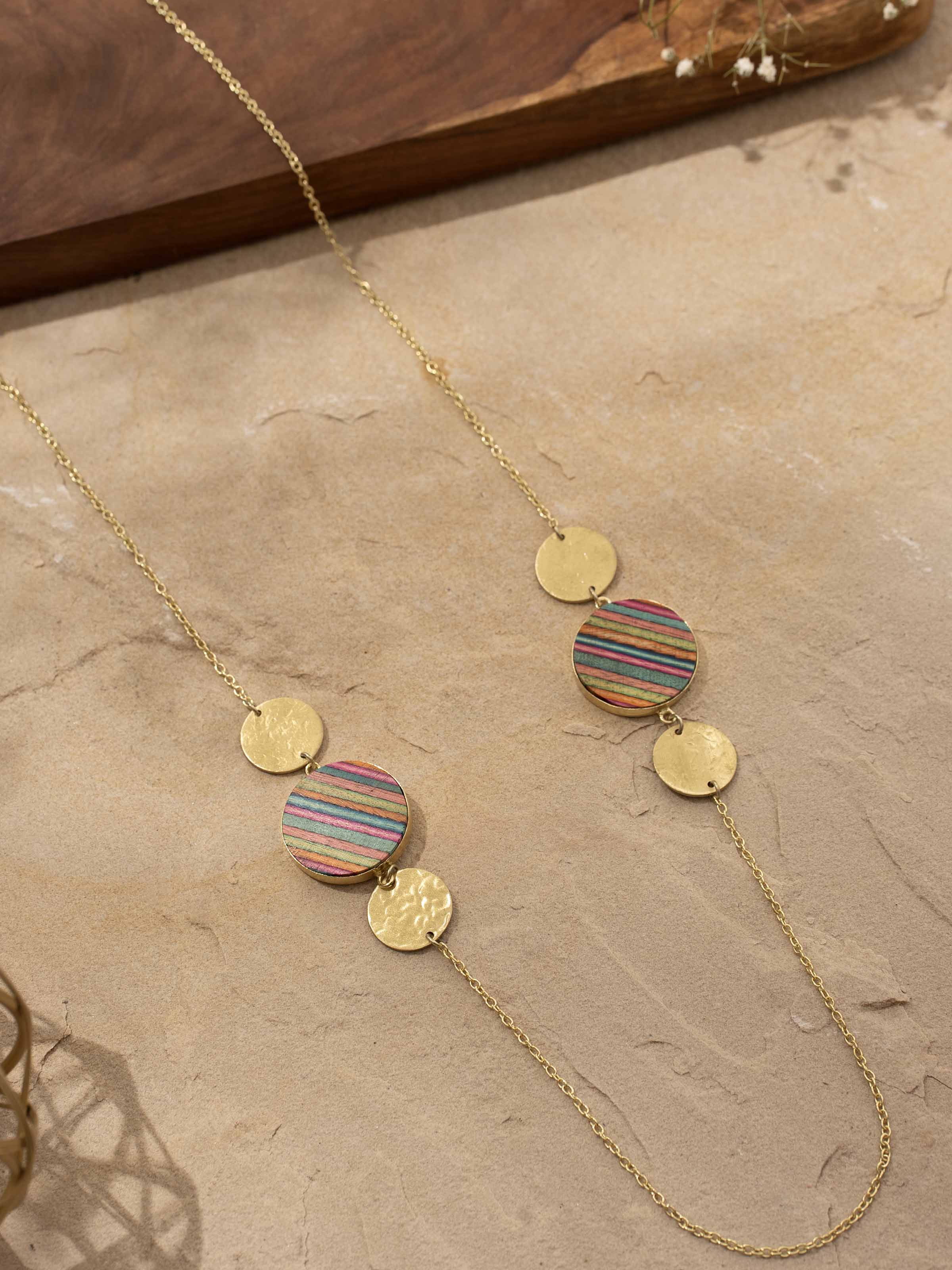 Lifestyle shot displaying the necklace styled with an outfit