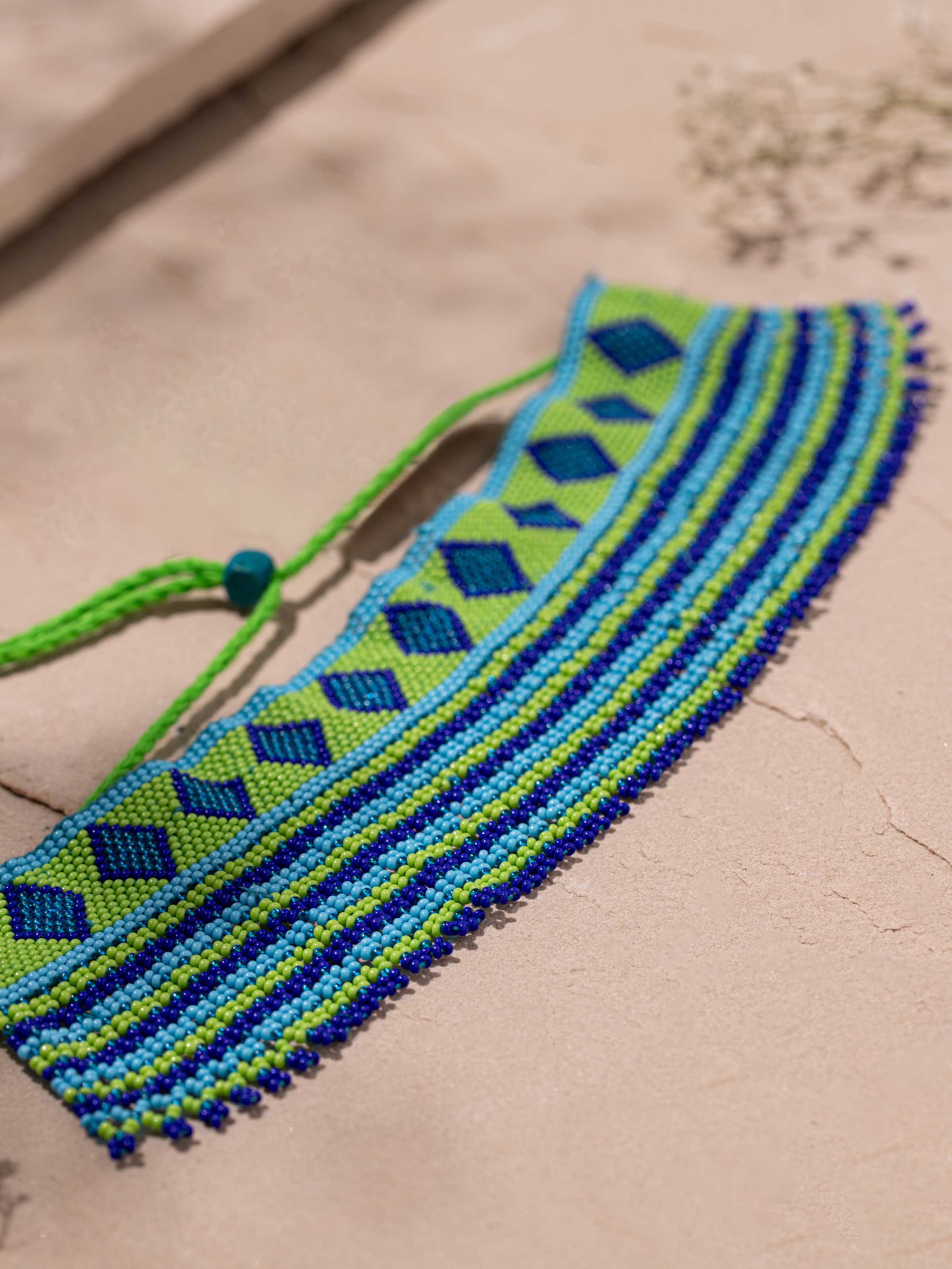 Detailed front view of handcrafted collar necklace highlighting its sophisticated artistry