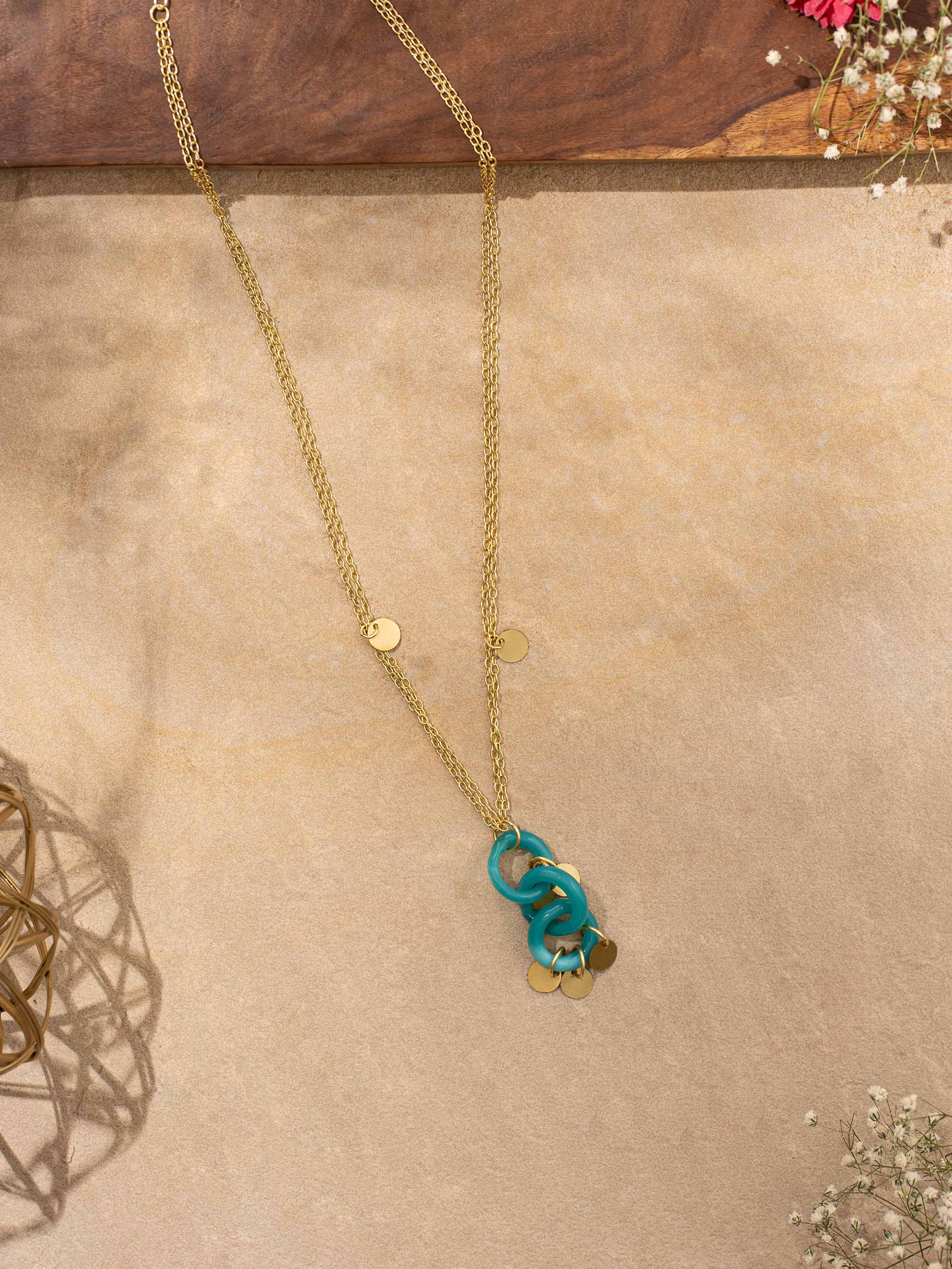 Side view of Glass Bead Pendant & Chain illustrating the pendant’s unique shape and bead arrangement.