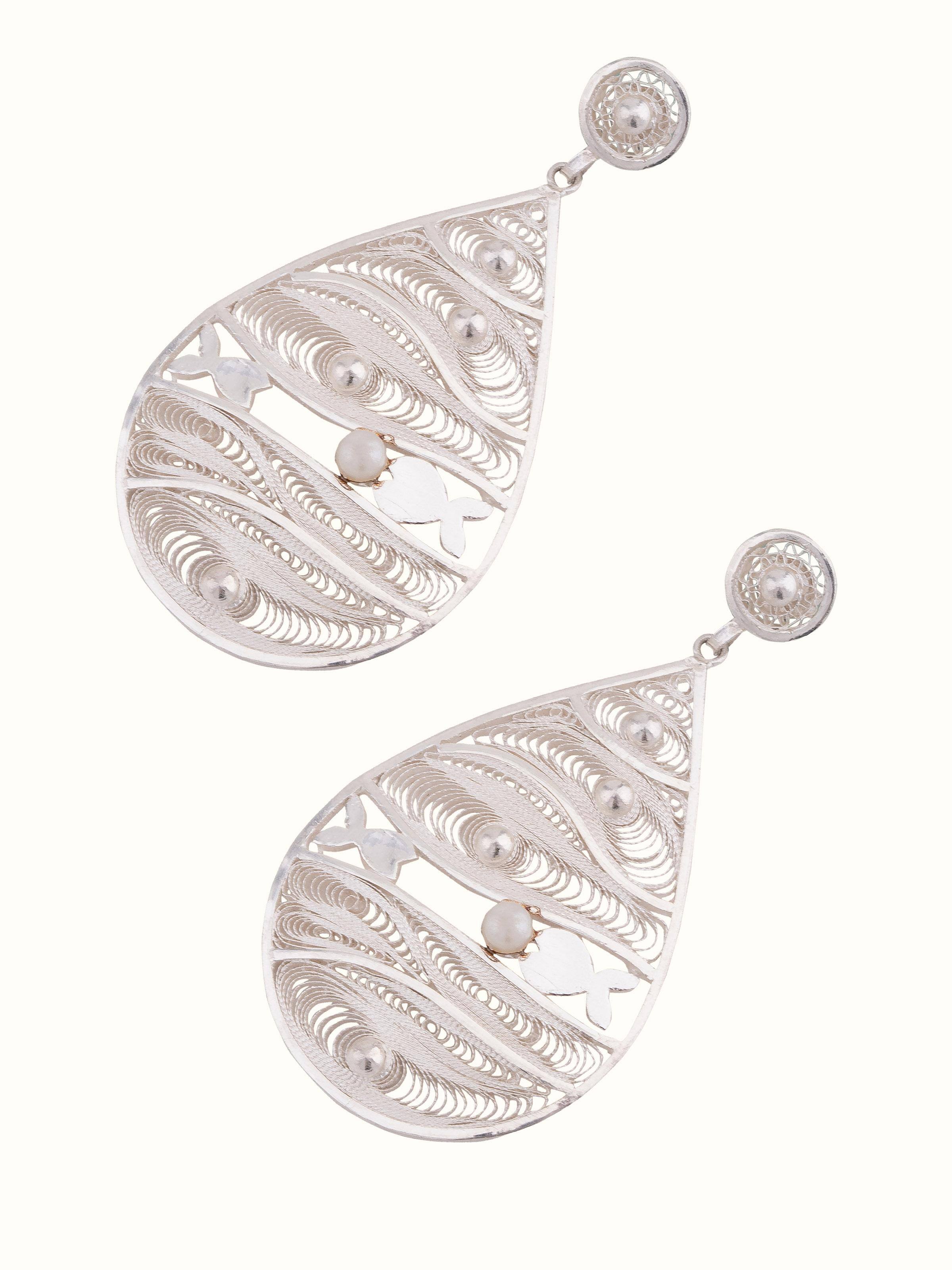 Angled view of Silver Filigree Drop Earrings to highlight their stylish design.