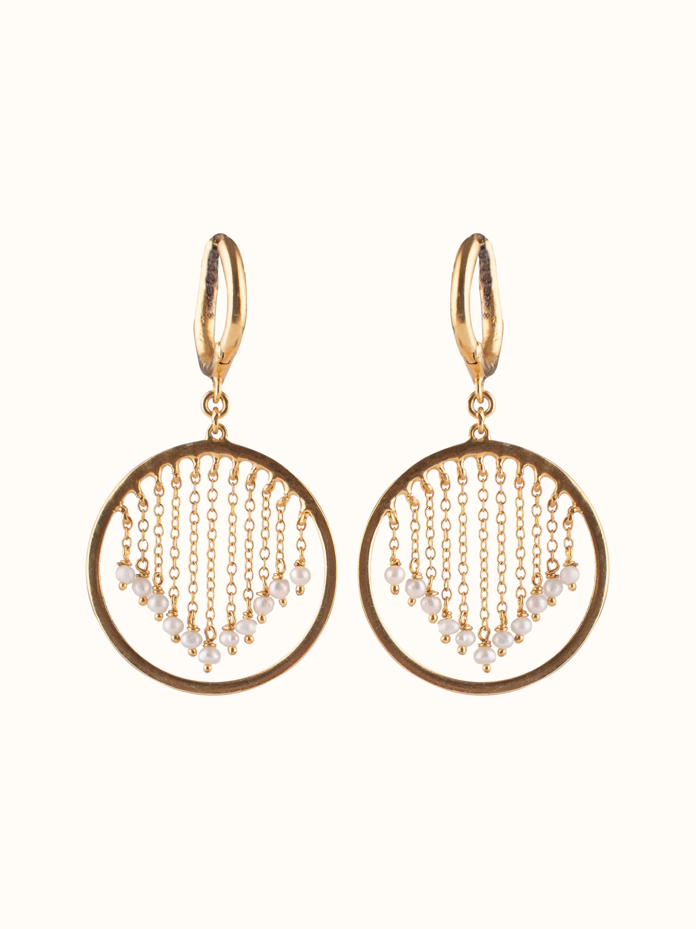 Front view of silver smithing drop earrings showcasing textured design and contemporary finish