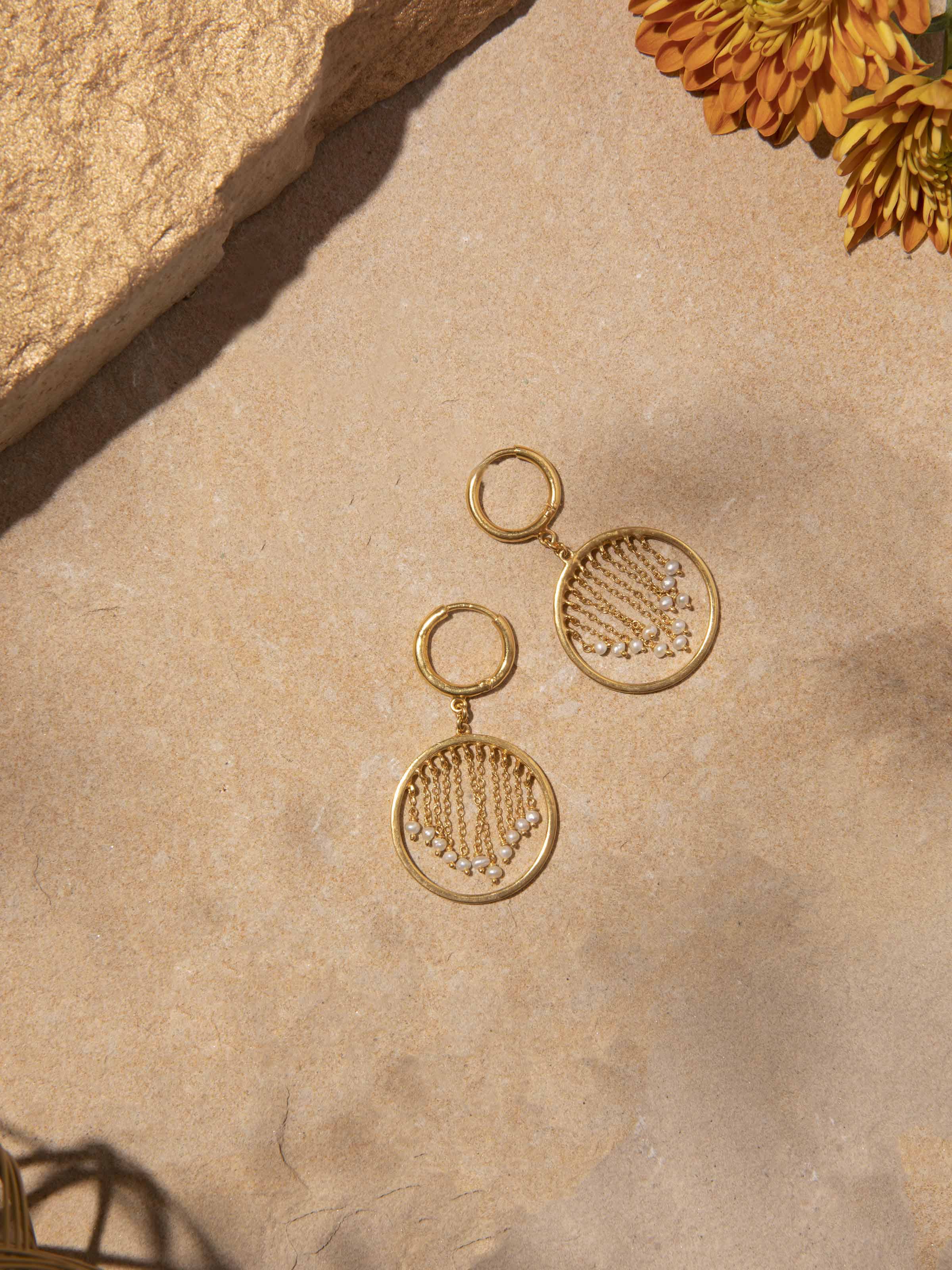 Side view of silver smithing drop earrings emphasizing subtle elegance and handcrafted detail