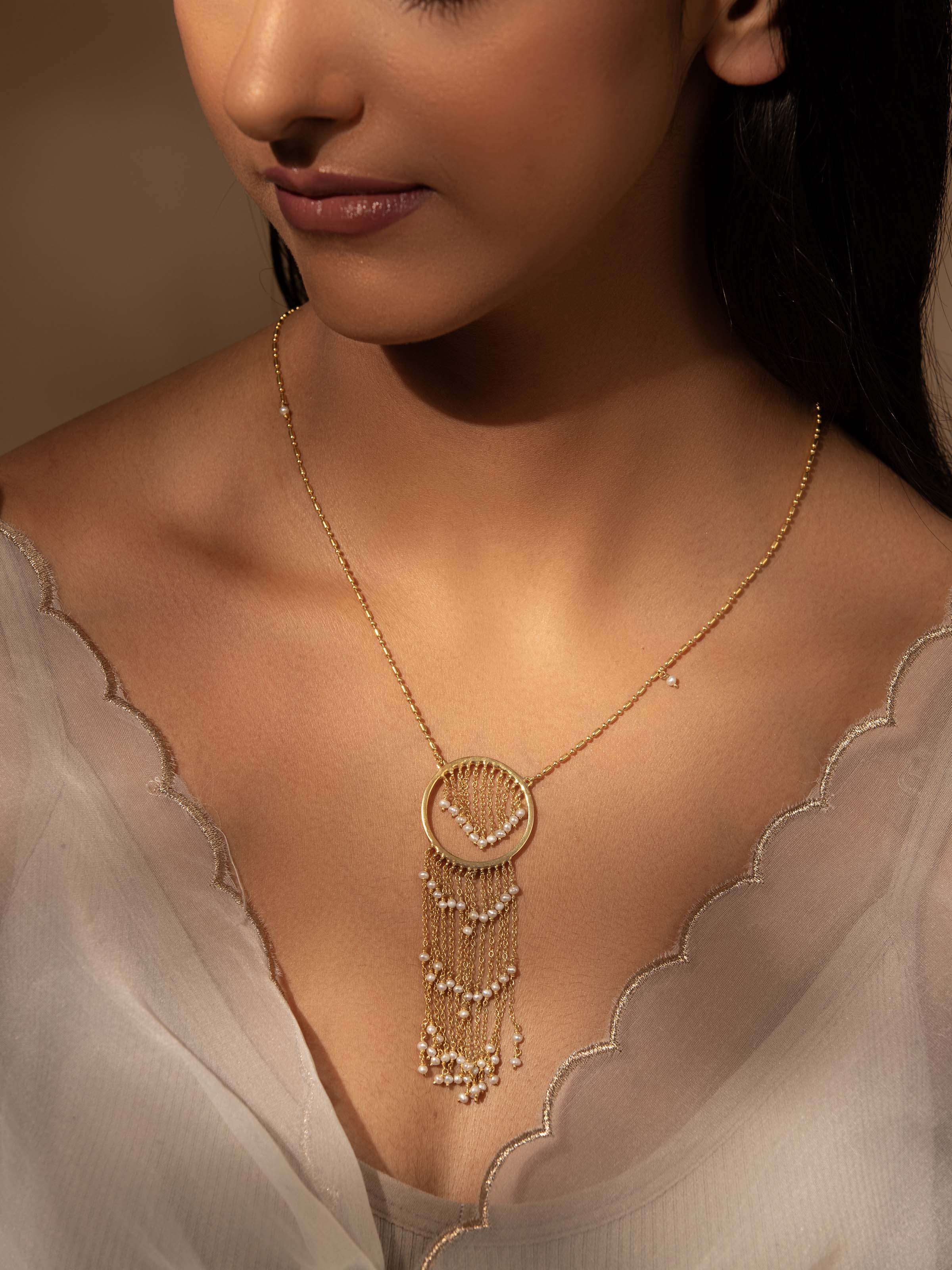 Side view of Silver Smithing Long Necklace highlighting the detailed silver work and elegant design.