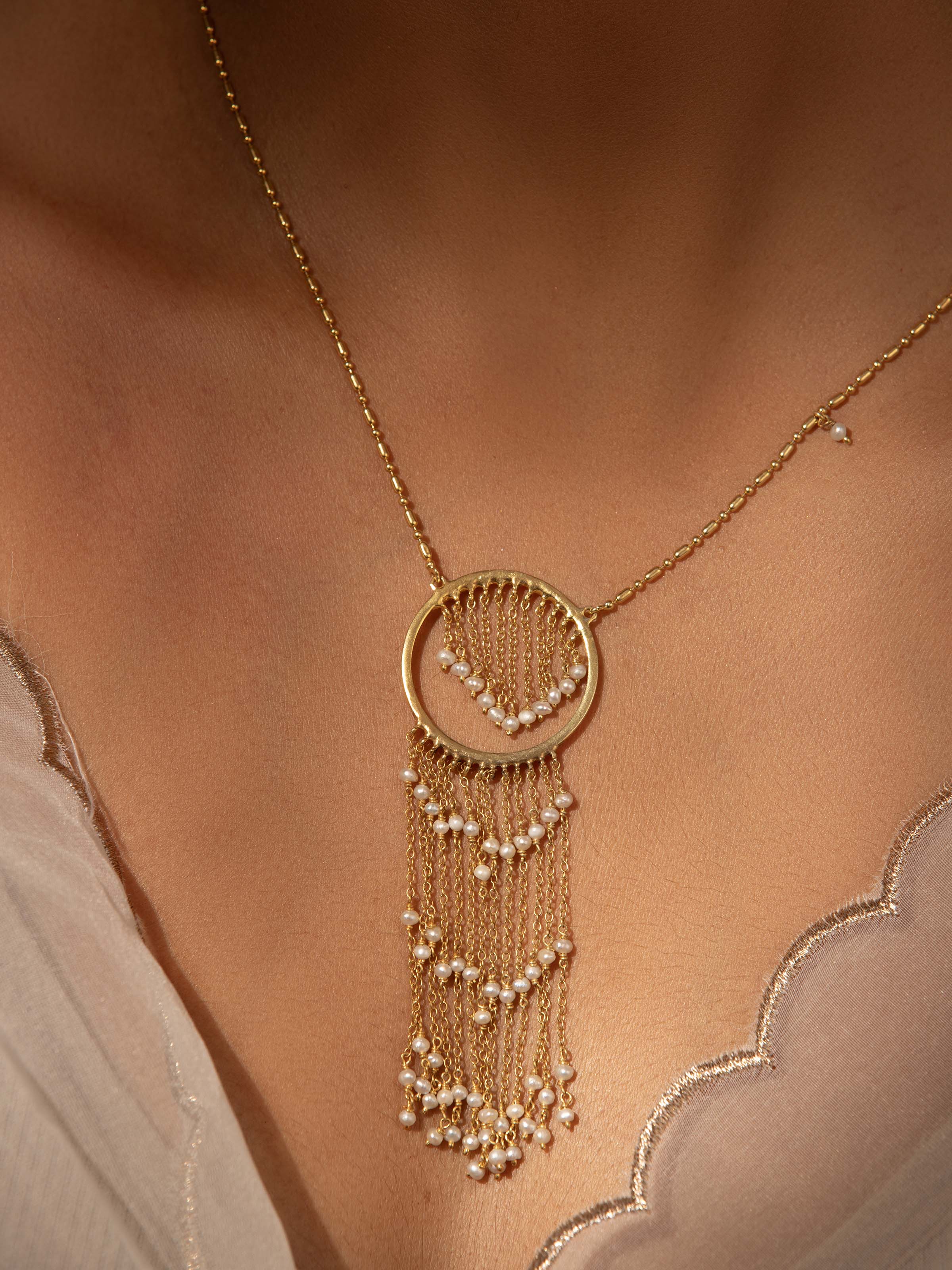 Close-up view of Silver Smithing Long Necklace showcasing fine craftsmanship and silver details.