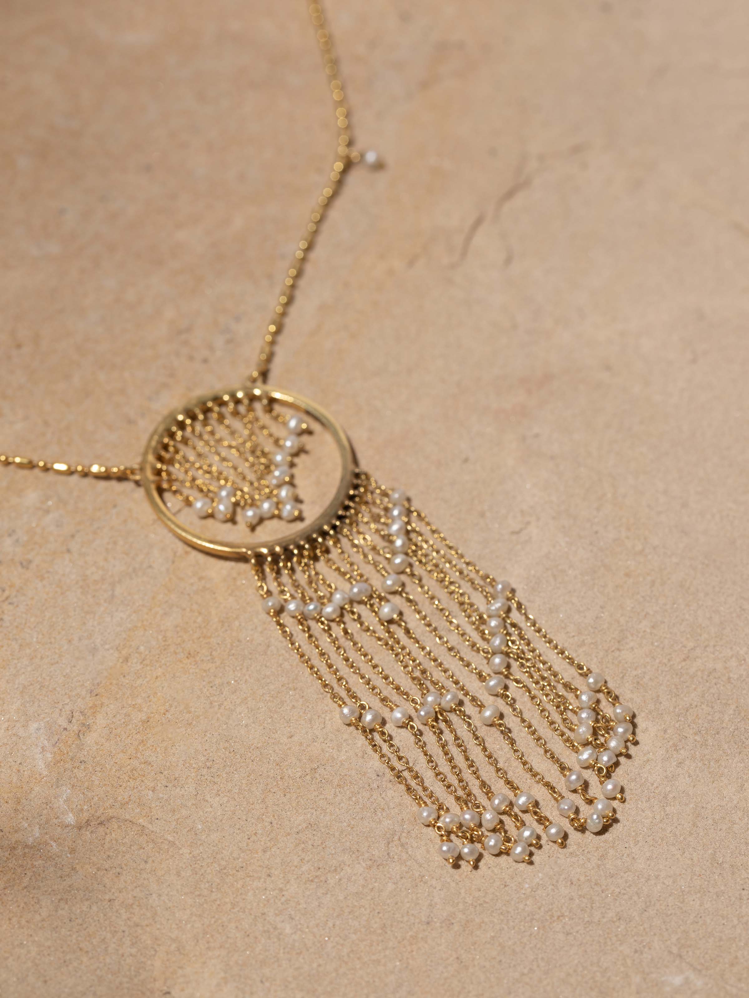 Detailed view of Silver Smithing Long Necklace from a distance showcasing its full design and silver work.