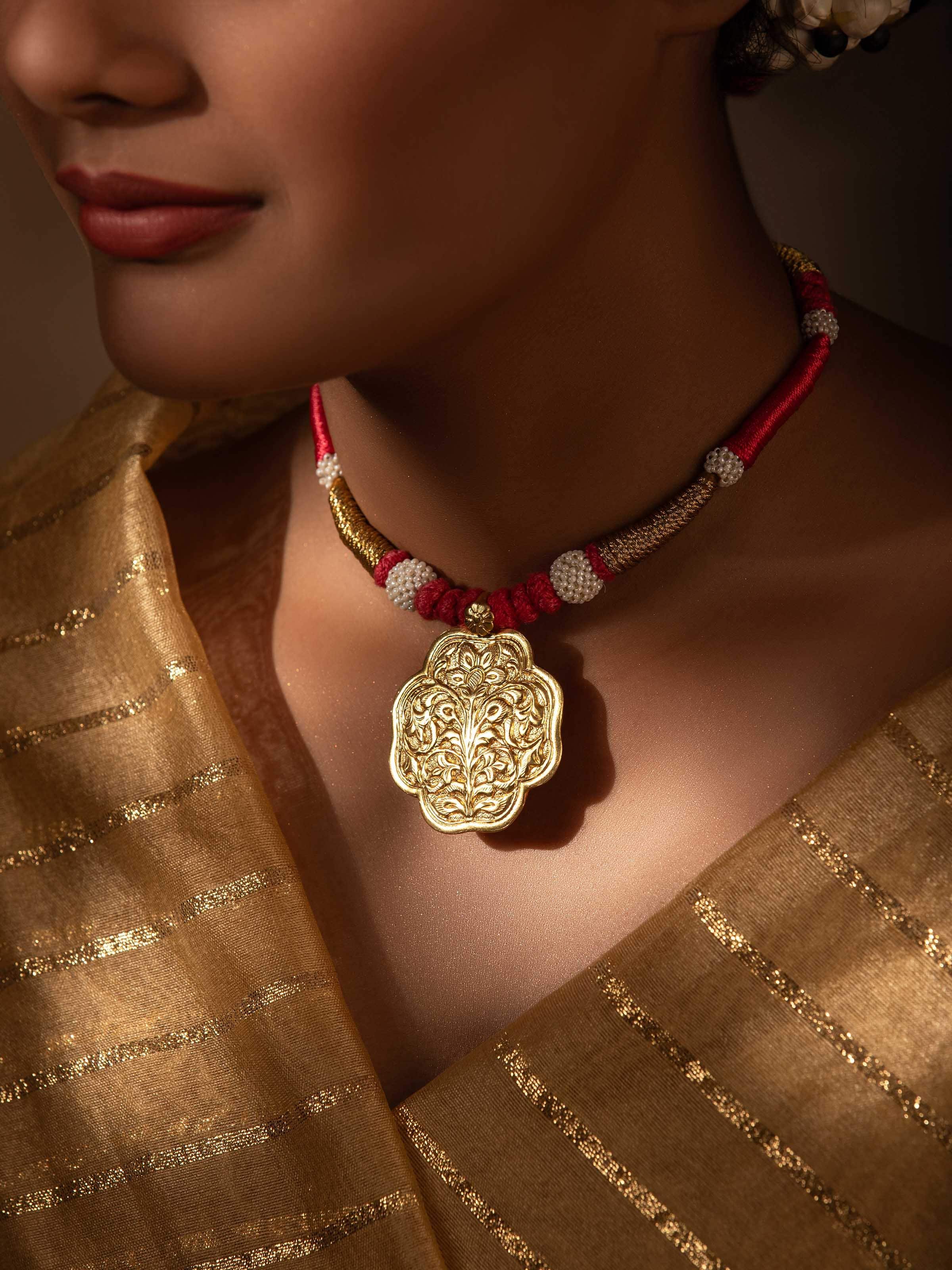 Side angle highlighting the necklace’s curvature and elegant design