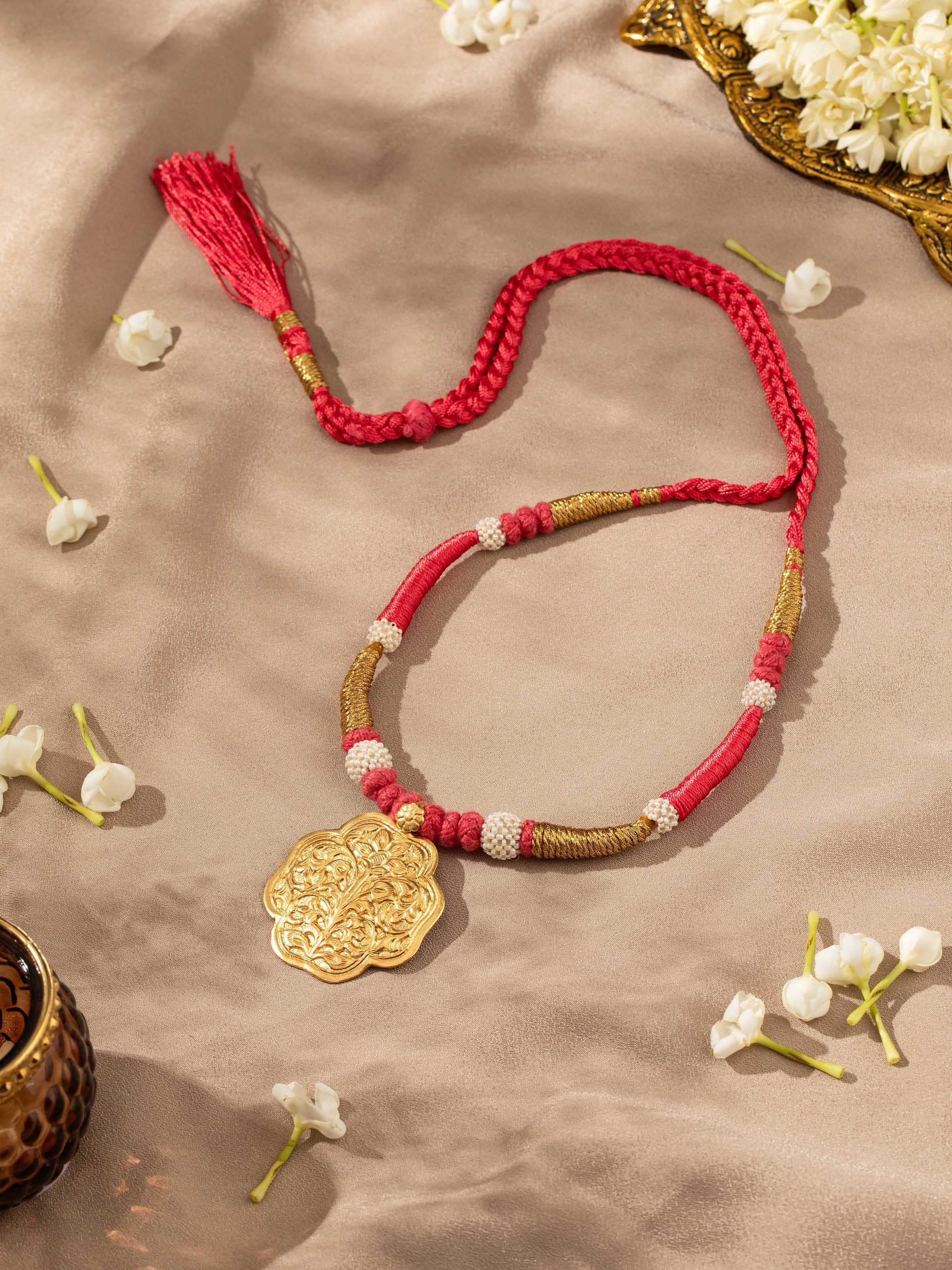 Artistic overhead view emphasizing texture and fine craftsmanship of the silver necklace