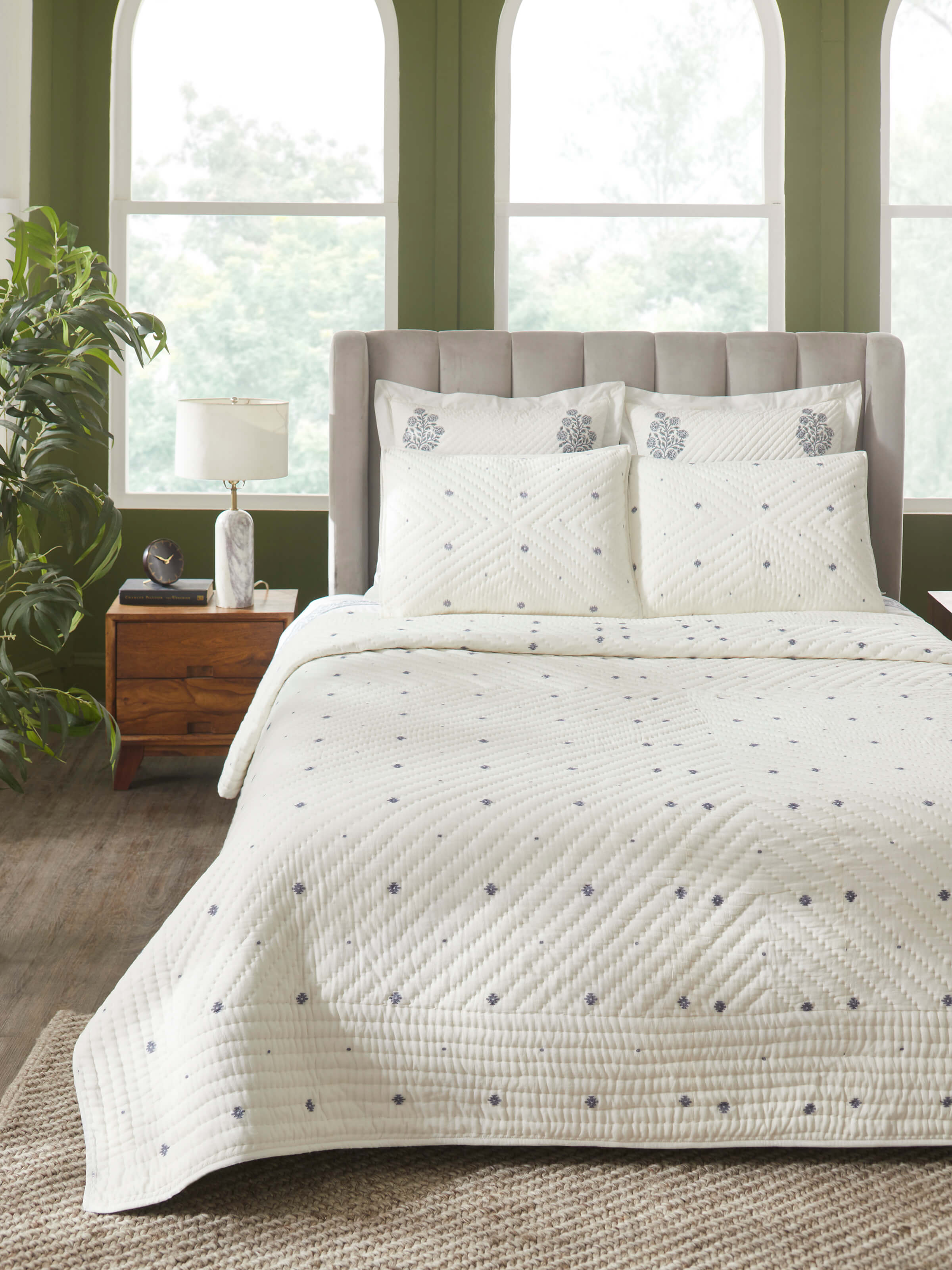 Close-up view of Kalpanama ivory woven buti cotton quilt double, focusing on the detailed weaving and pattern.