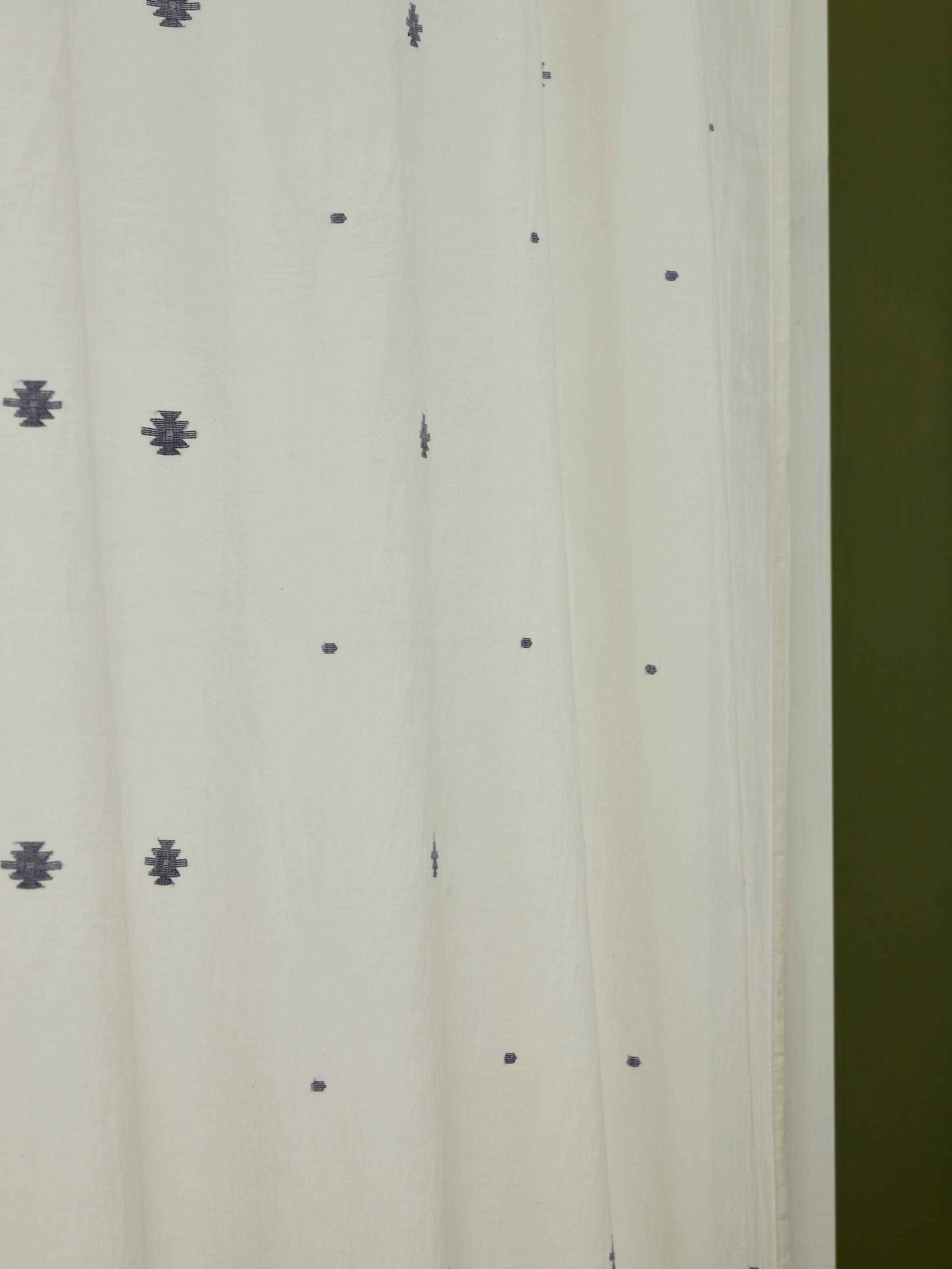 Kalpanama ivory & blue woven buti handloom cotton curtain (9 ft) draped to show its appearance and design.