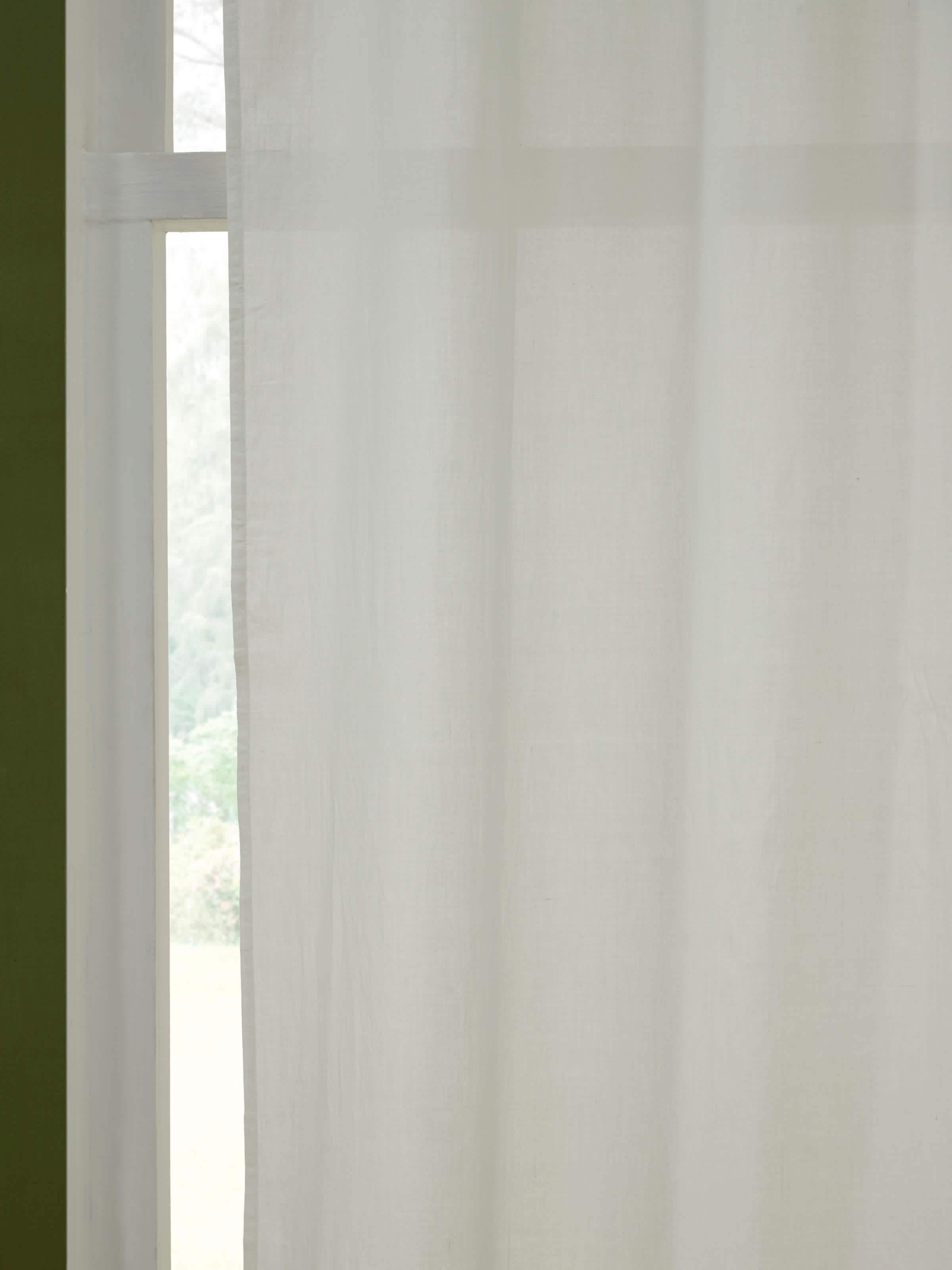 Detailed view of Kalpanama ivory solid handloom cotton curtain (9 ft) showing the fabric’s texture and solid color.