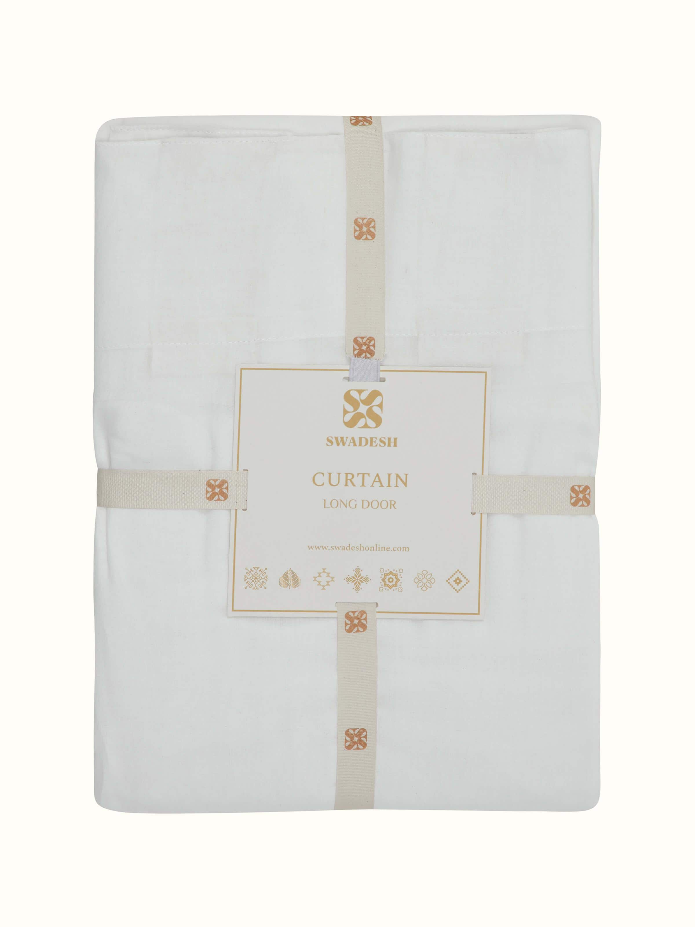 Perspective view of Kalpanama ivory solid handloom cotton curtain (9 ft) capturing the curtain’s full length and texture.