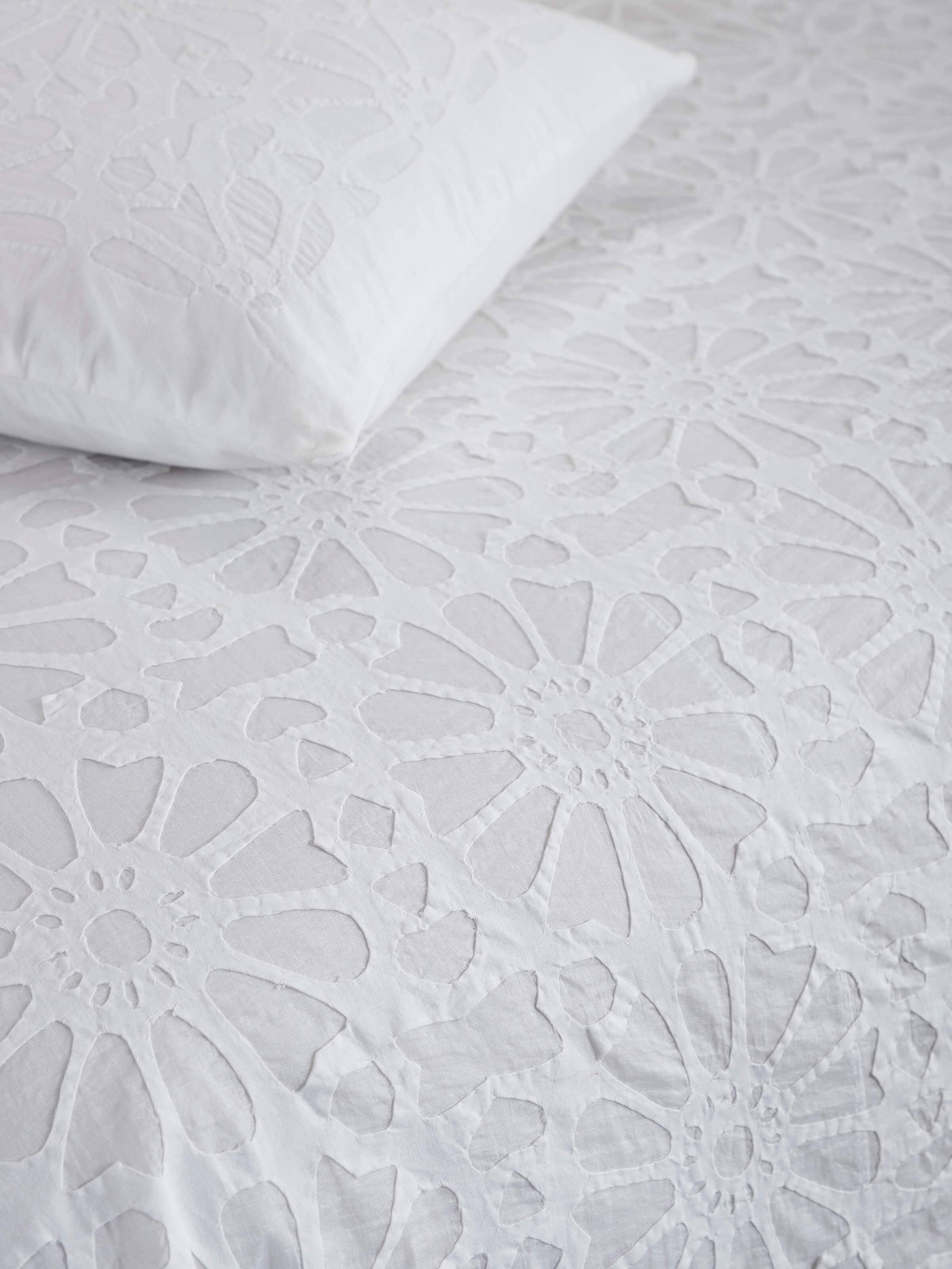 Angled view of Mandana White Jaali Cotton Appliqué King Bedspread Set (3 pcs), displaying the full set's design and layout.