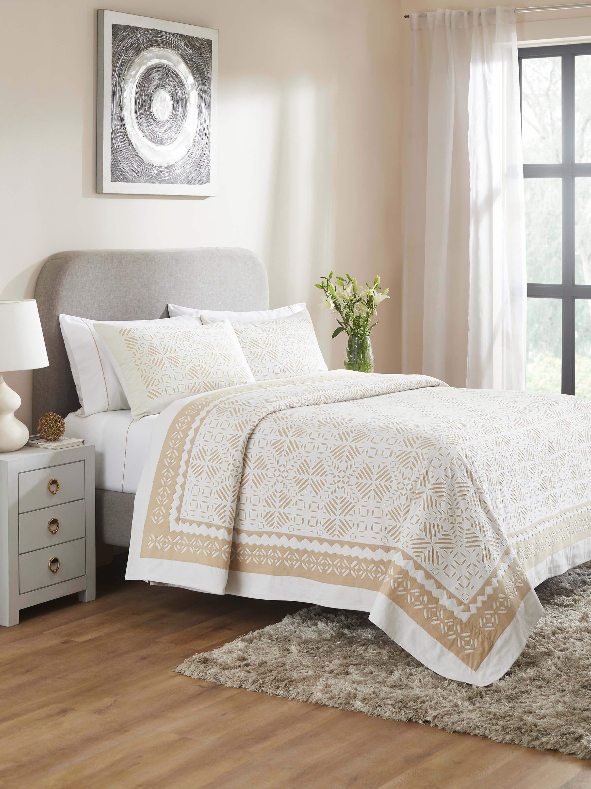 Lifestyle image of Jharokha Beige Trellis Cotton Appliqué King Bedspread Set arranged on a bed in a bedroom setting.