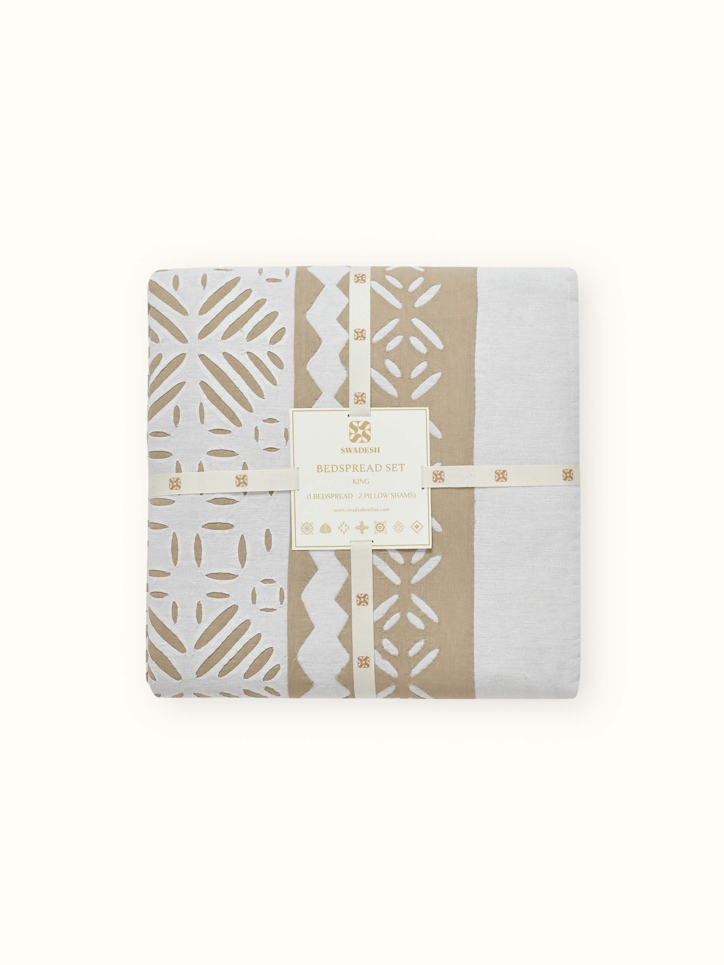 Jharokha Beige Trellis Cotton Appliqué King Bedspread Set folded to display the texture and appliqué design