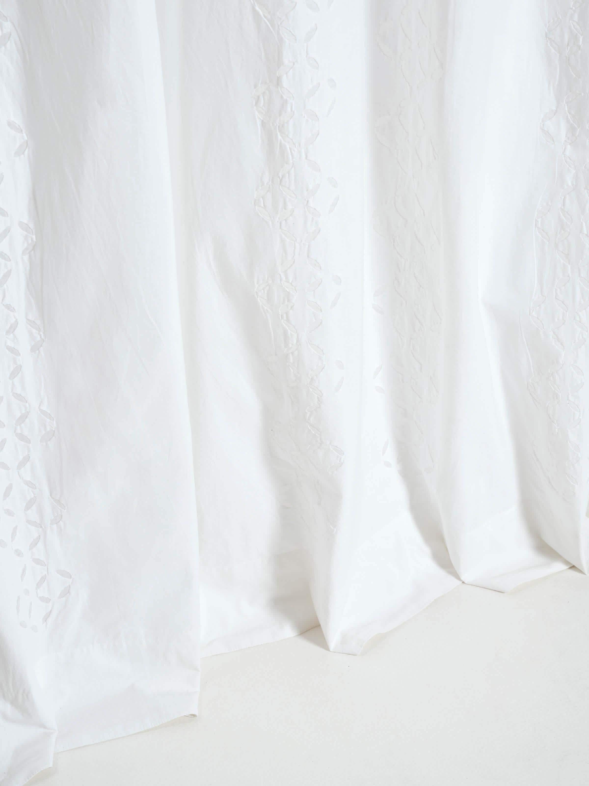 Full view of Mandana White Trellis Stripe Cotton Applique Sheer Curtain (9 ft), showing the curtain hanging and the overall pattern.